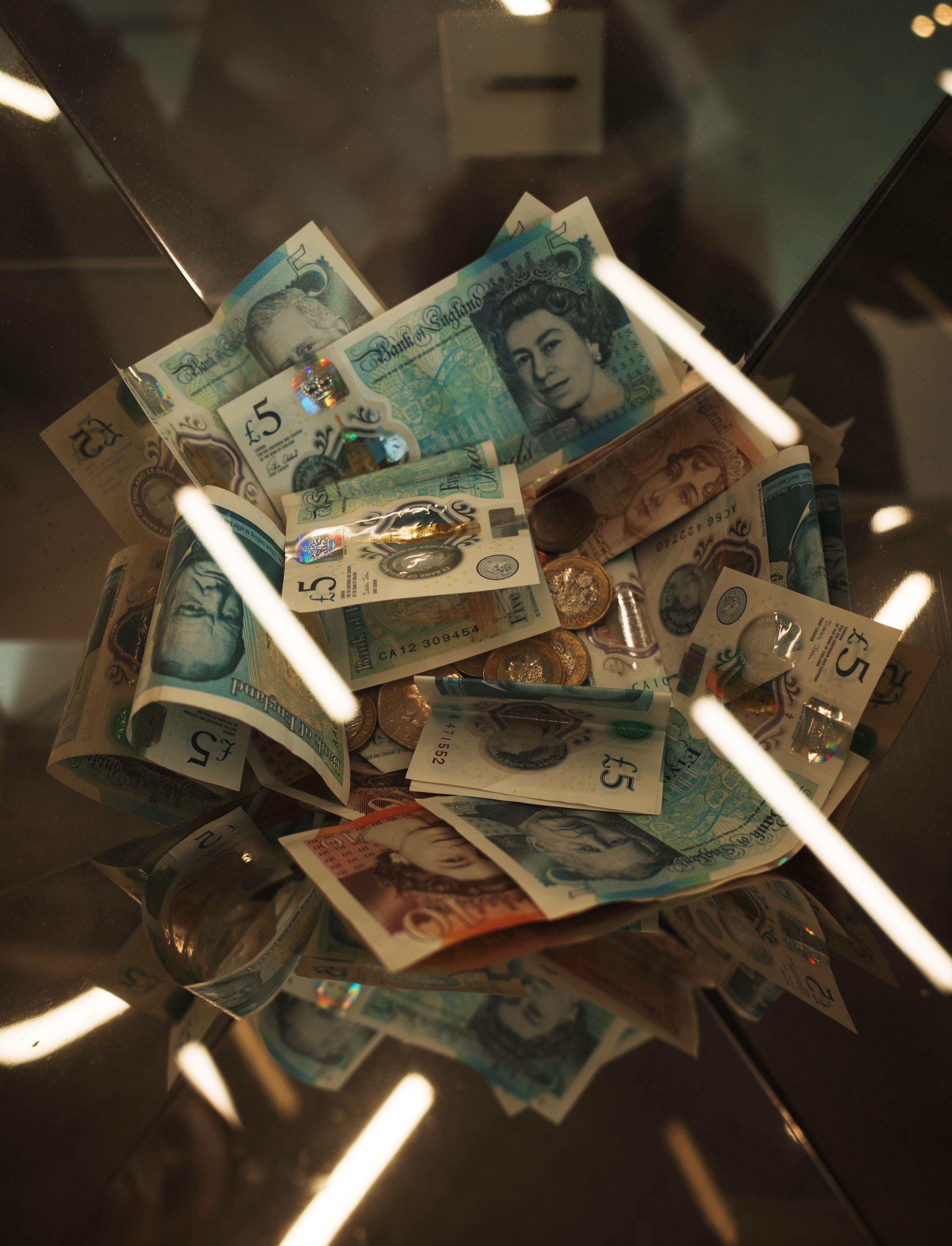 3810x4986 Pile of British Pound Currency in Glass Box · Free