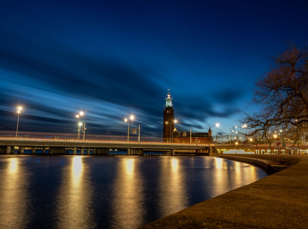 1074x800 Stockholm City Hall Illuminated at Twilight with Reflections on Water posters & prints by Pär Norgren