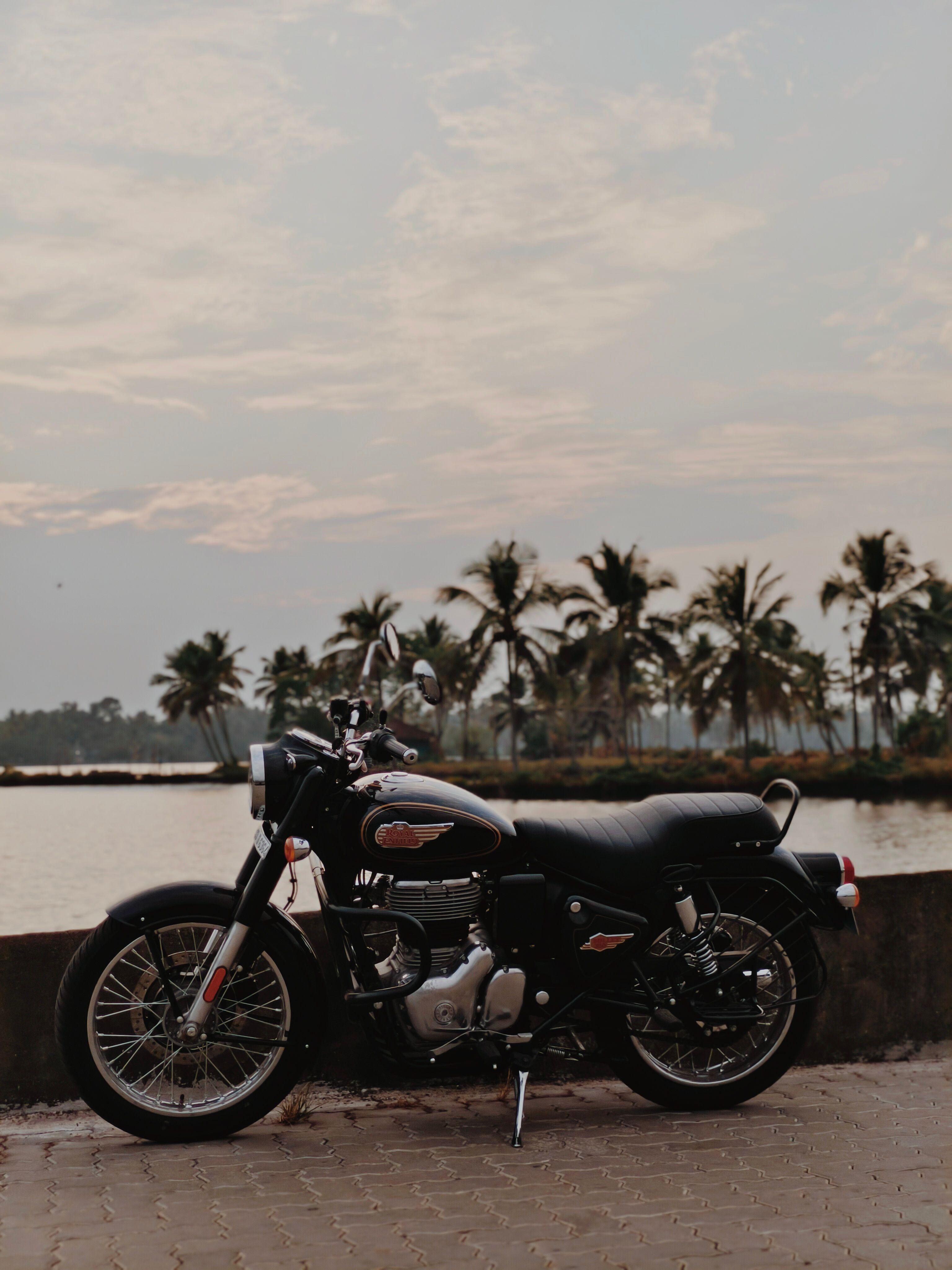 3072x4096 Classic Motorcycle by Tropical Waterfront at Sunset · Free