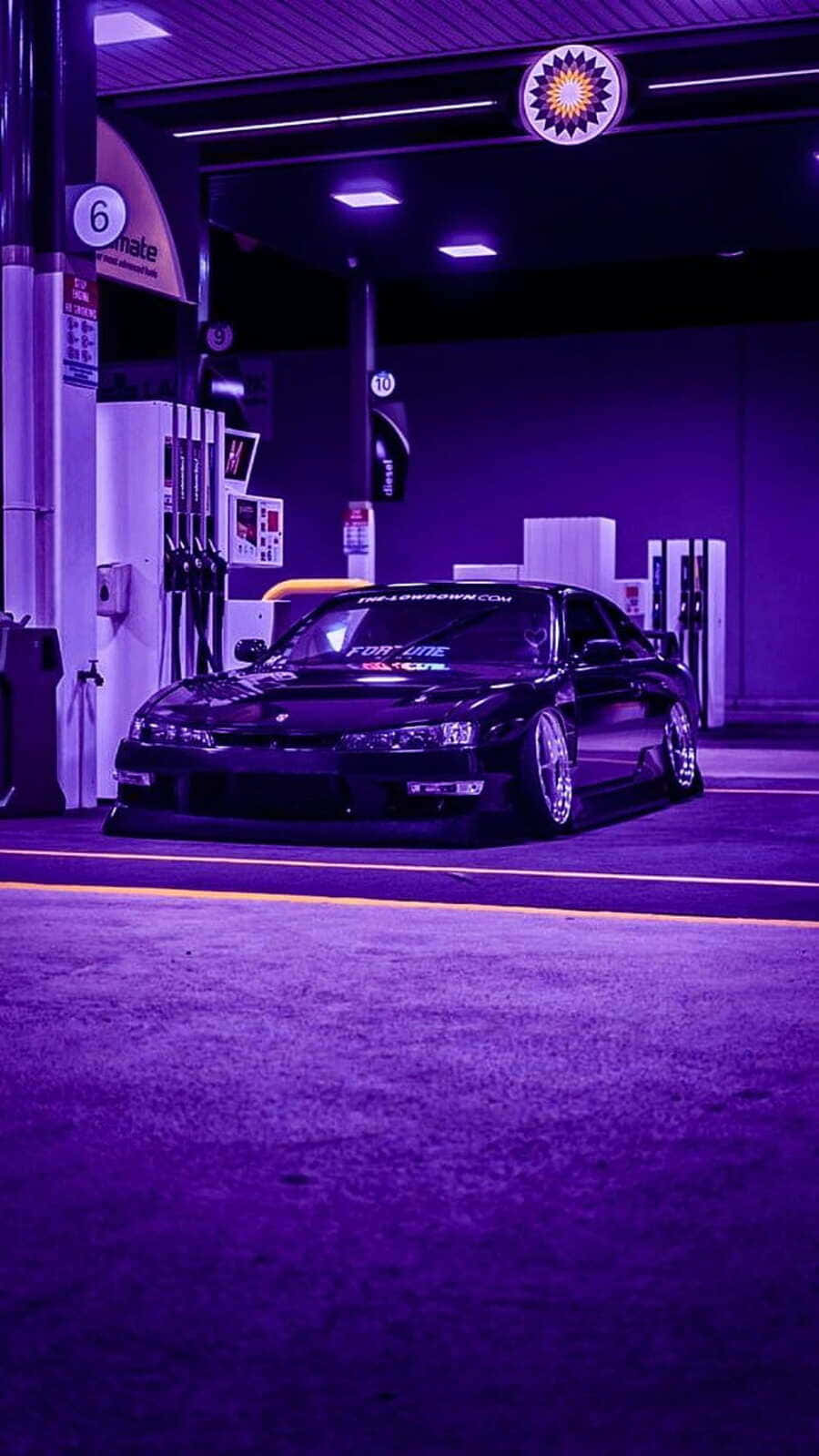 900x1599 Download Nighttime J D M Car At Gas Station Wallpaper