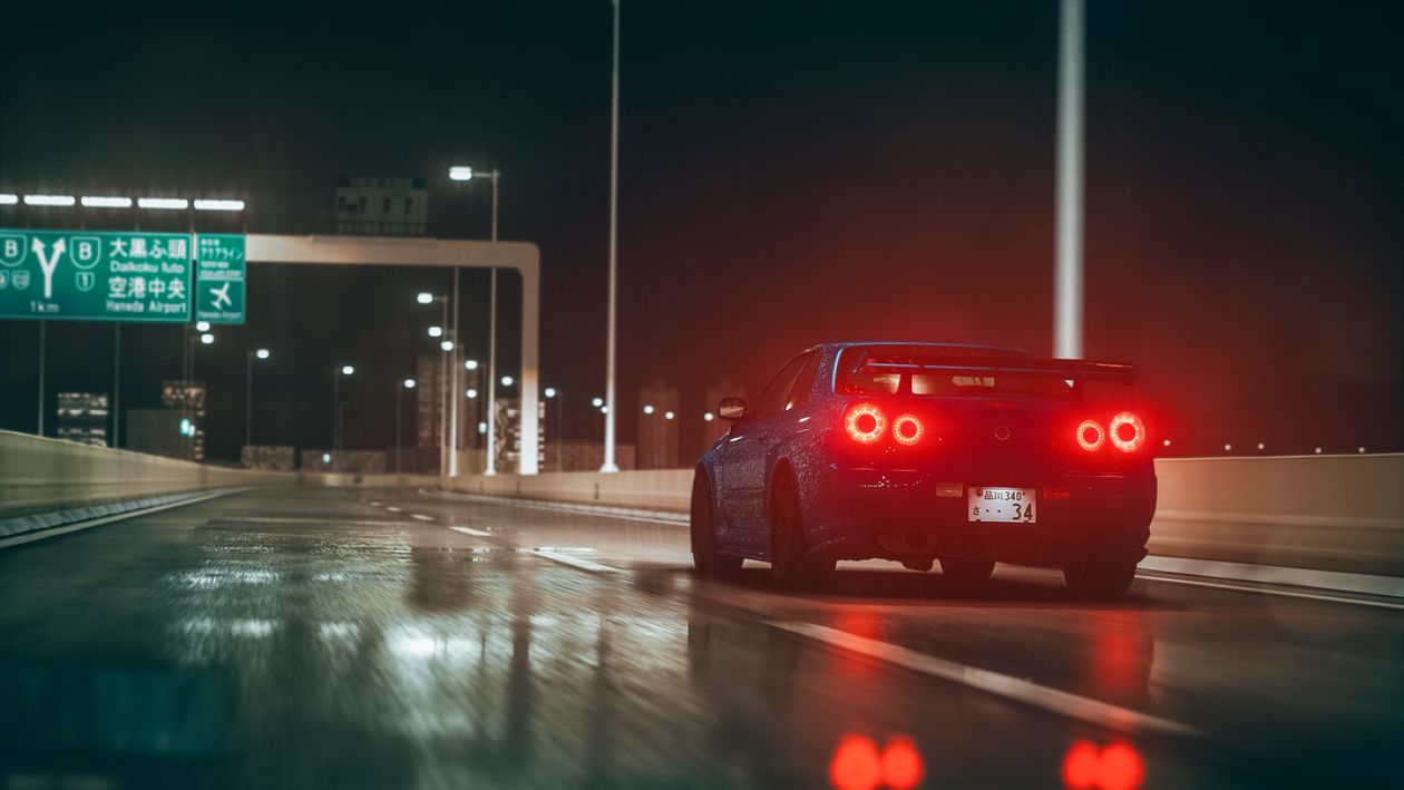 1260x709 A Car With Illuminated Tail Lights on a Wet Road at Nighttime · Free