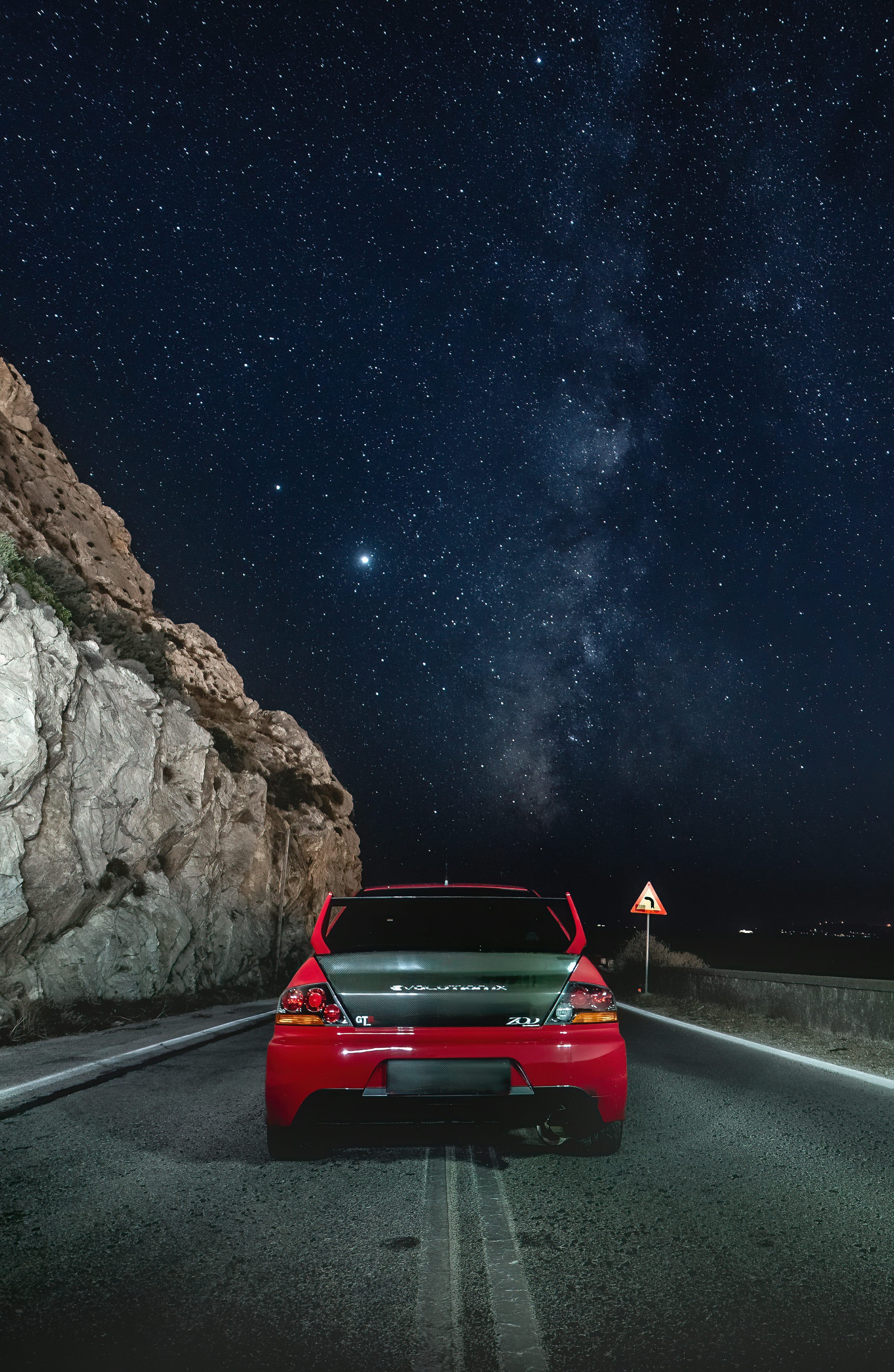 3000x4601 Red car on road during night time
