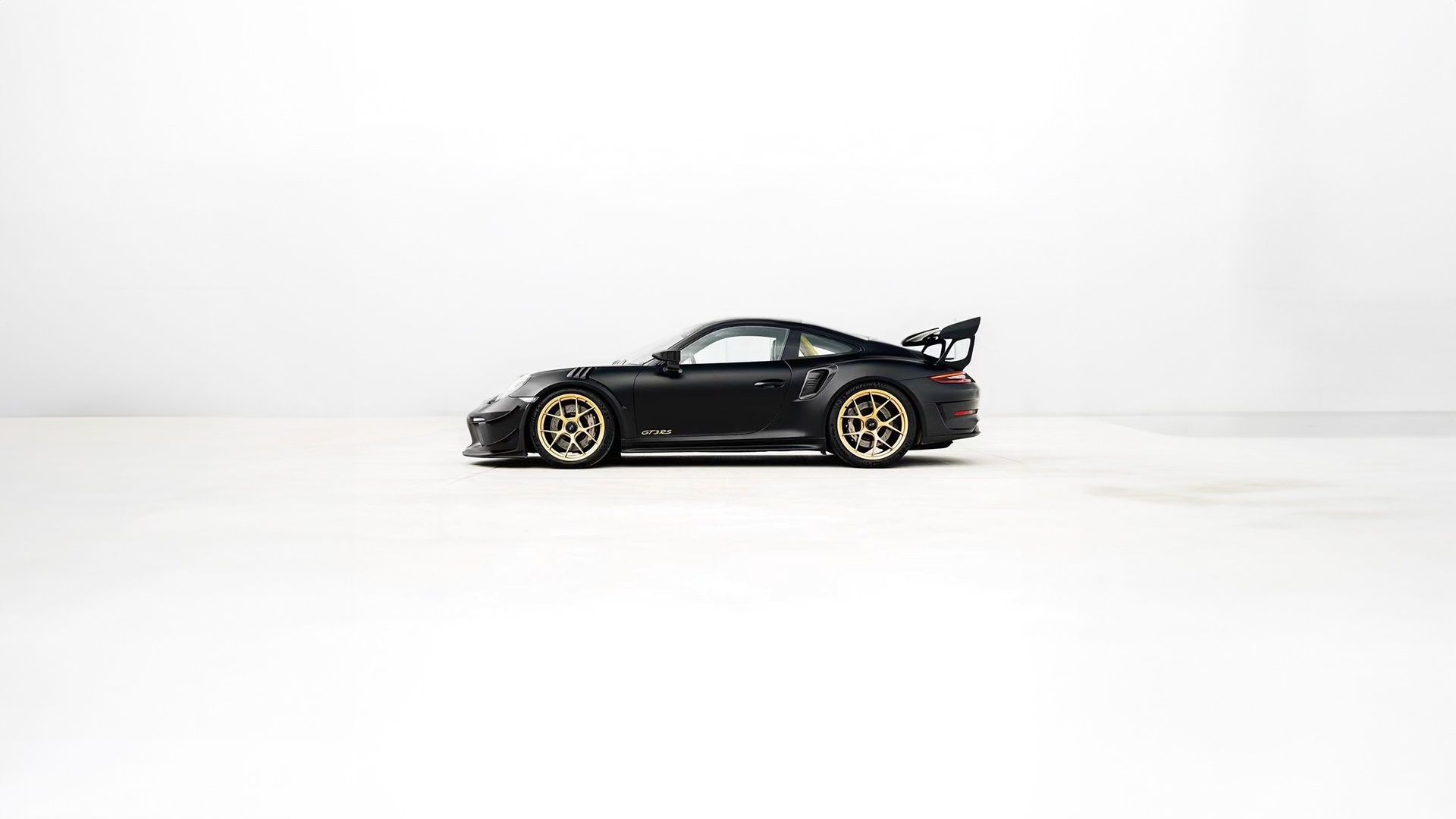 1920x1080 Minimalist Black Porsche 911 GT3 RS on Clean White Background