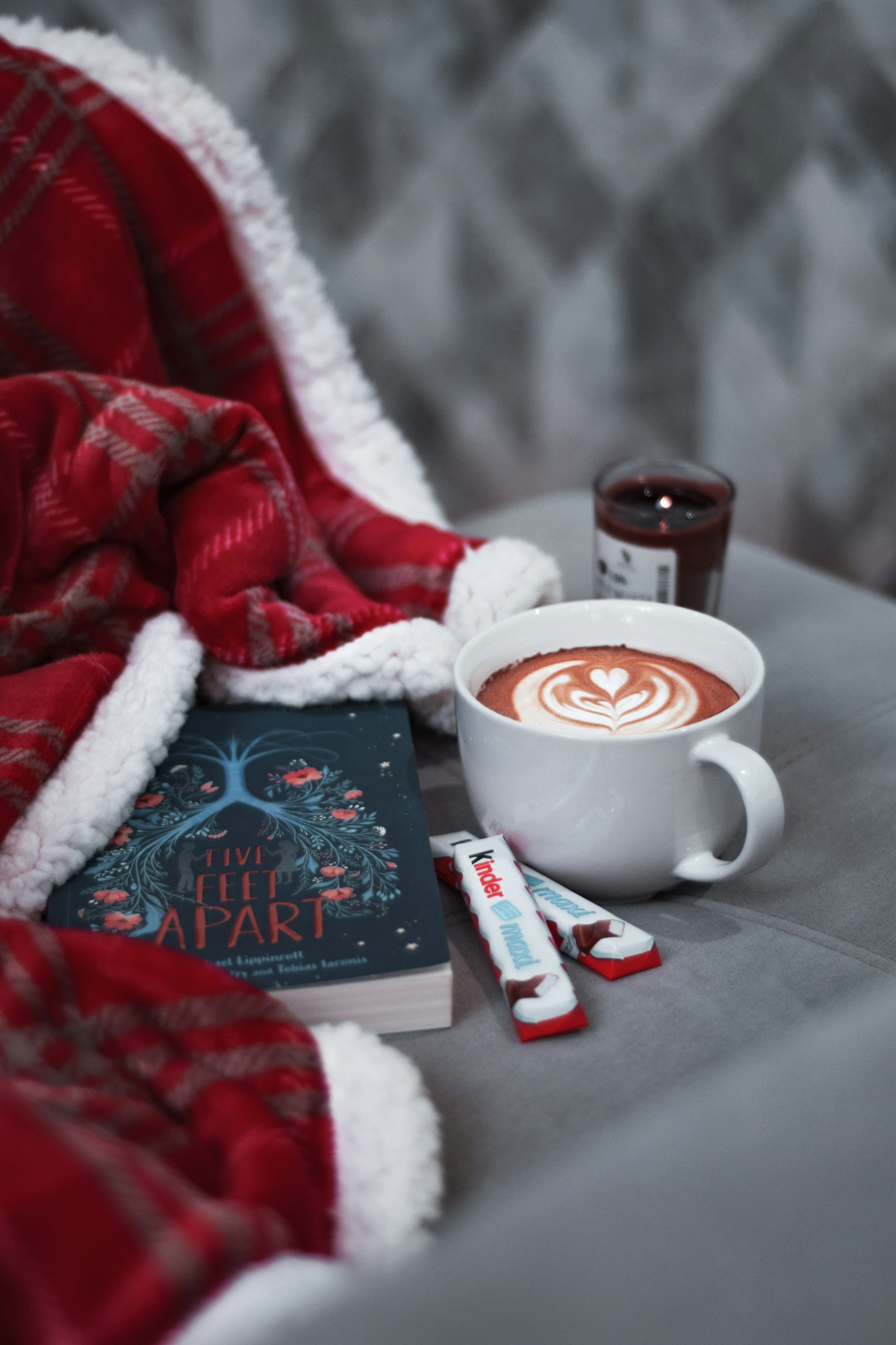 3000x4500 A cup of hot chocolate next to a book