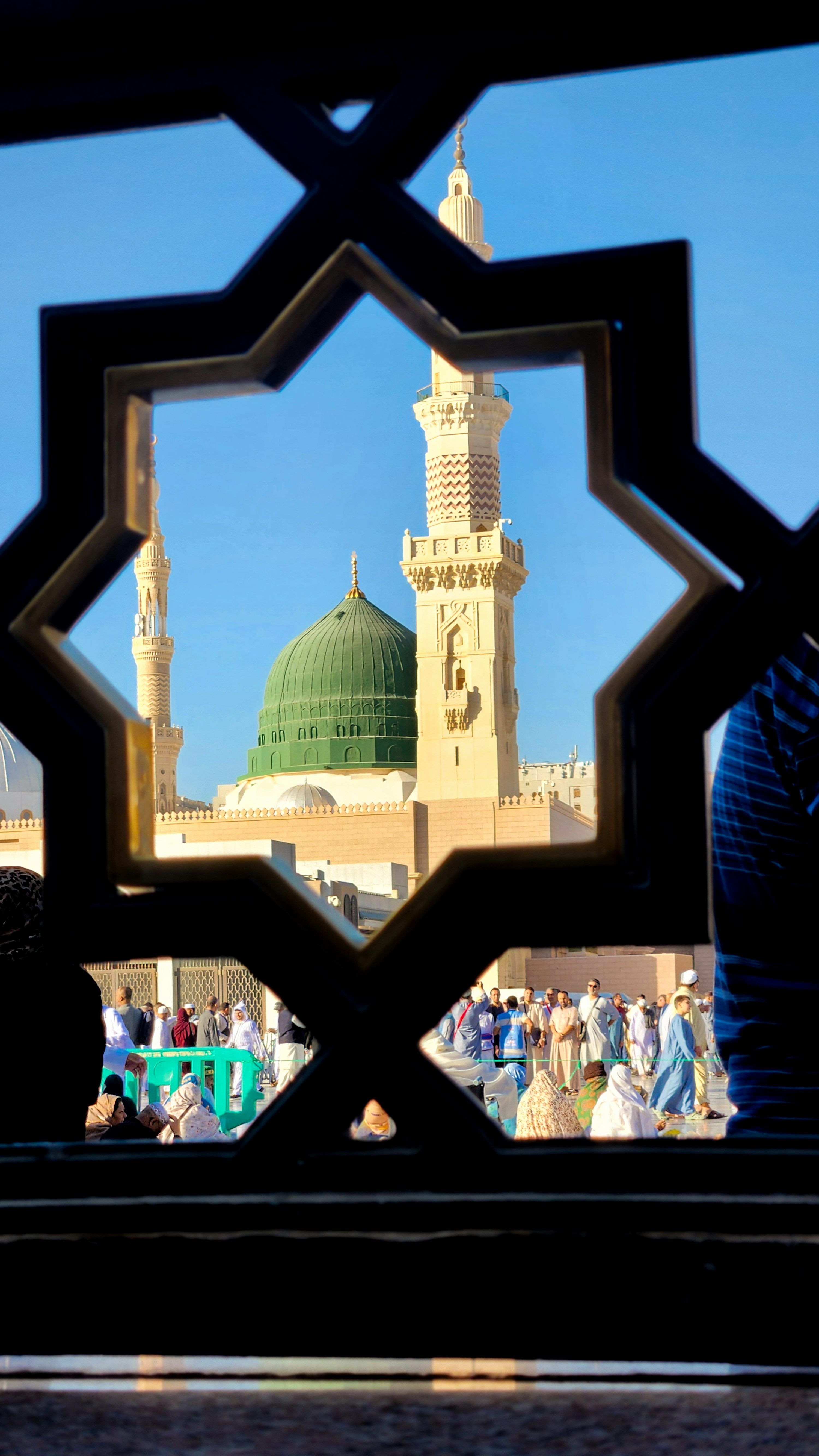 3000x5329 A view of a mosque through a window