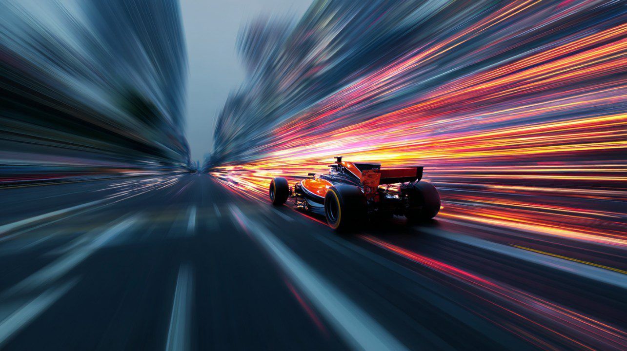 1285x720 High Speed Formula 1 Car Racing Through Futuristic Cityscape