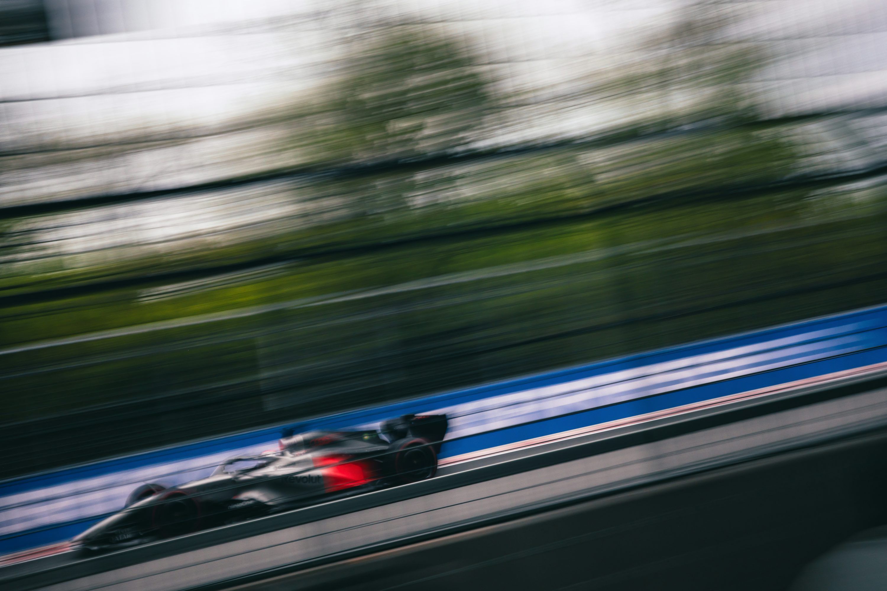3000x2000 A bobsled speeds down an icy track with motion blur