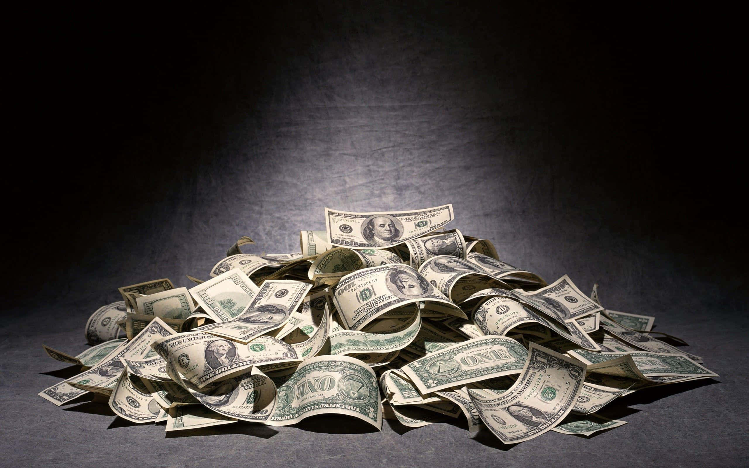 2560x1600 Download pile of money on a dark background Wallpaper