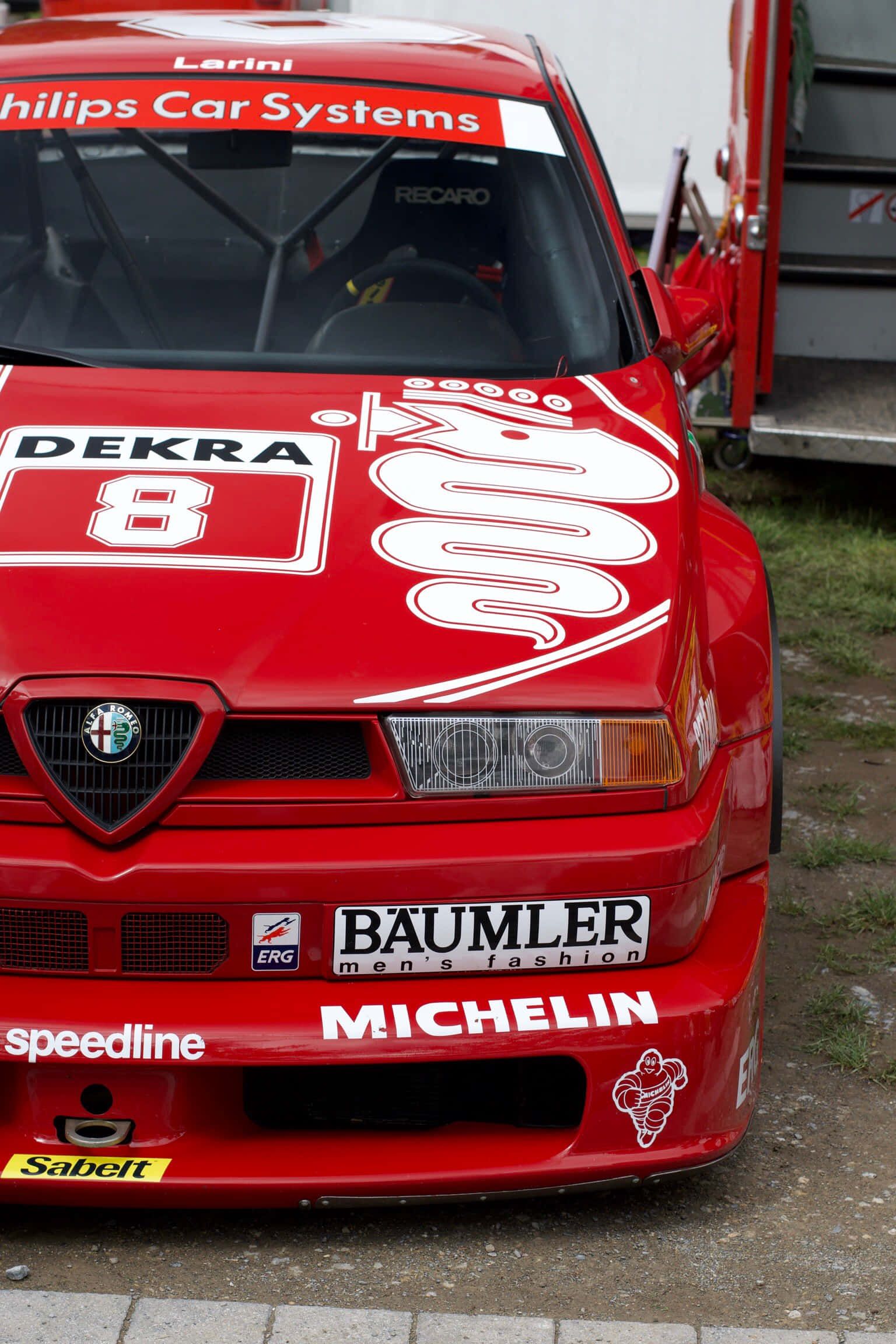 1536x2304 Download Experience the Thrill of Speed with Alfa Romeo Background
