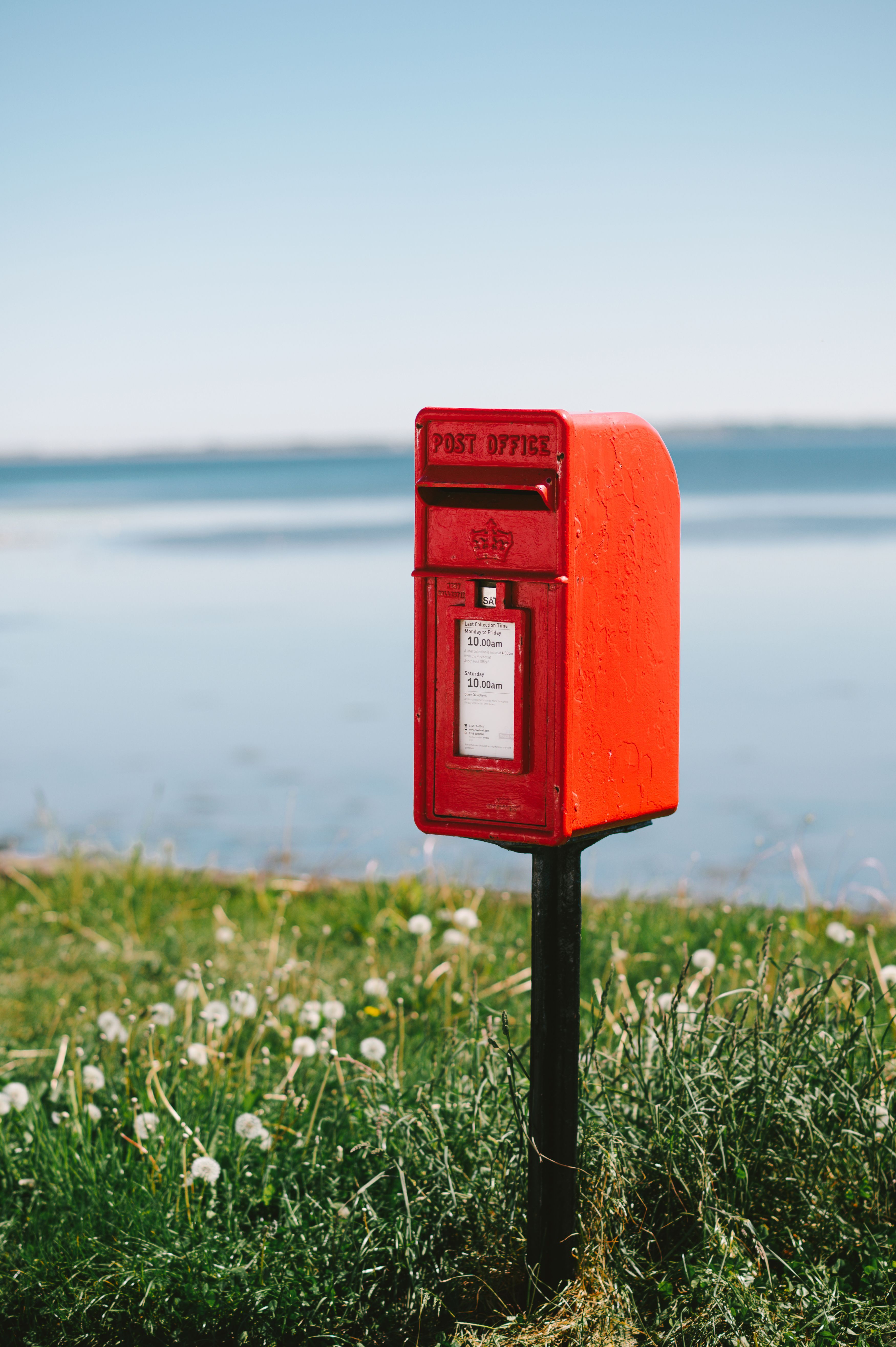 3500x5260 Classic Red British Post Box in Sunny Park · Free