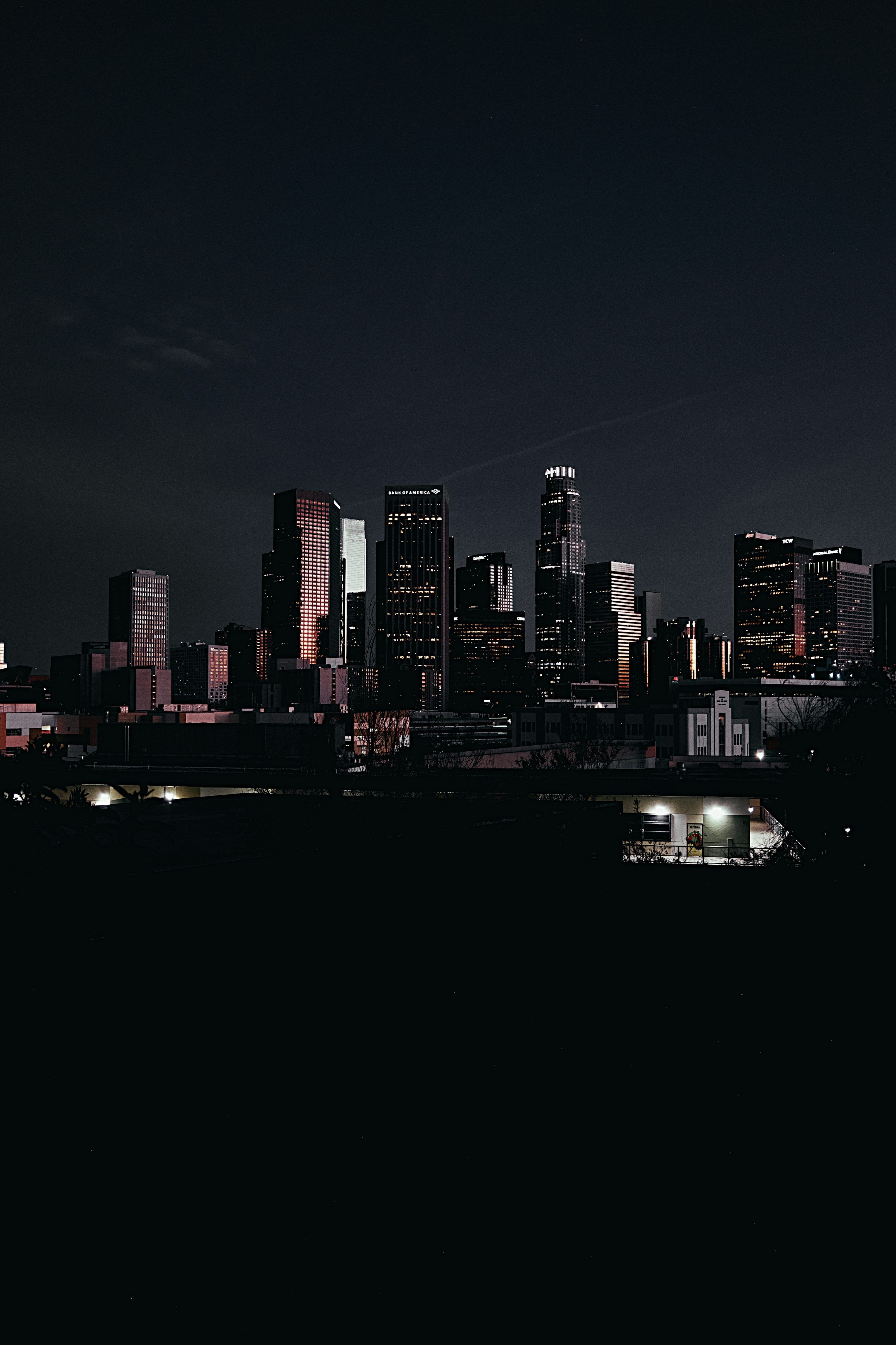 3000x4500 City skyline illuminated at night with dark foreground