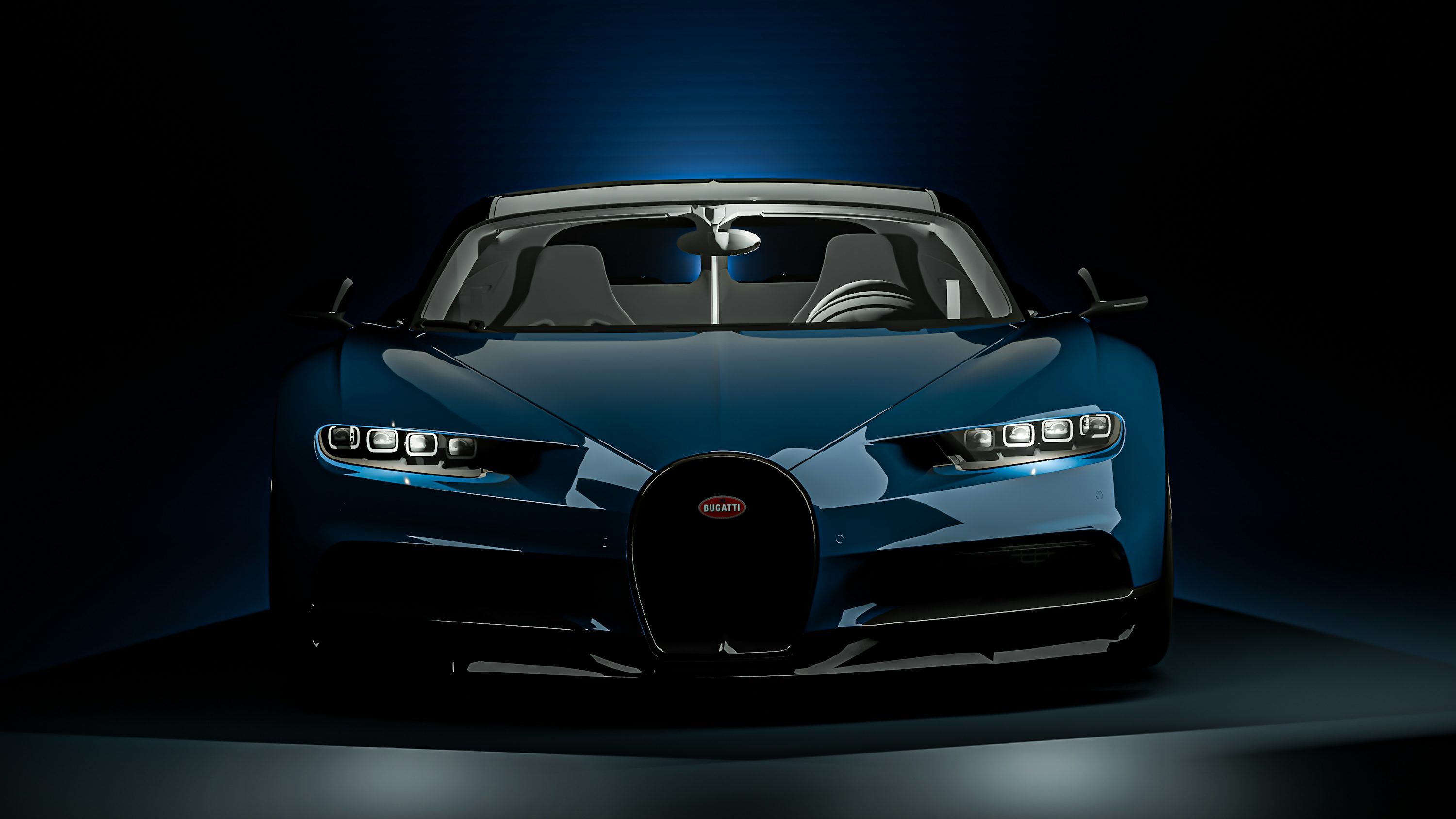 3000x1688 A blue car is shown in a dark room