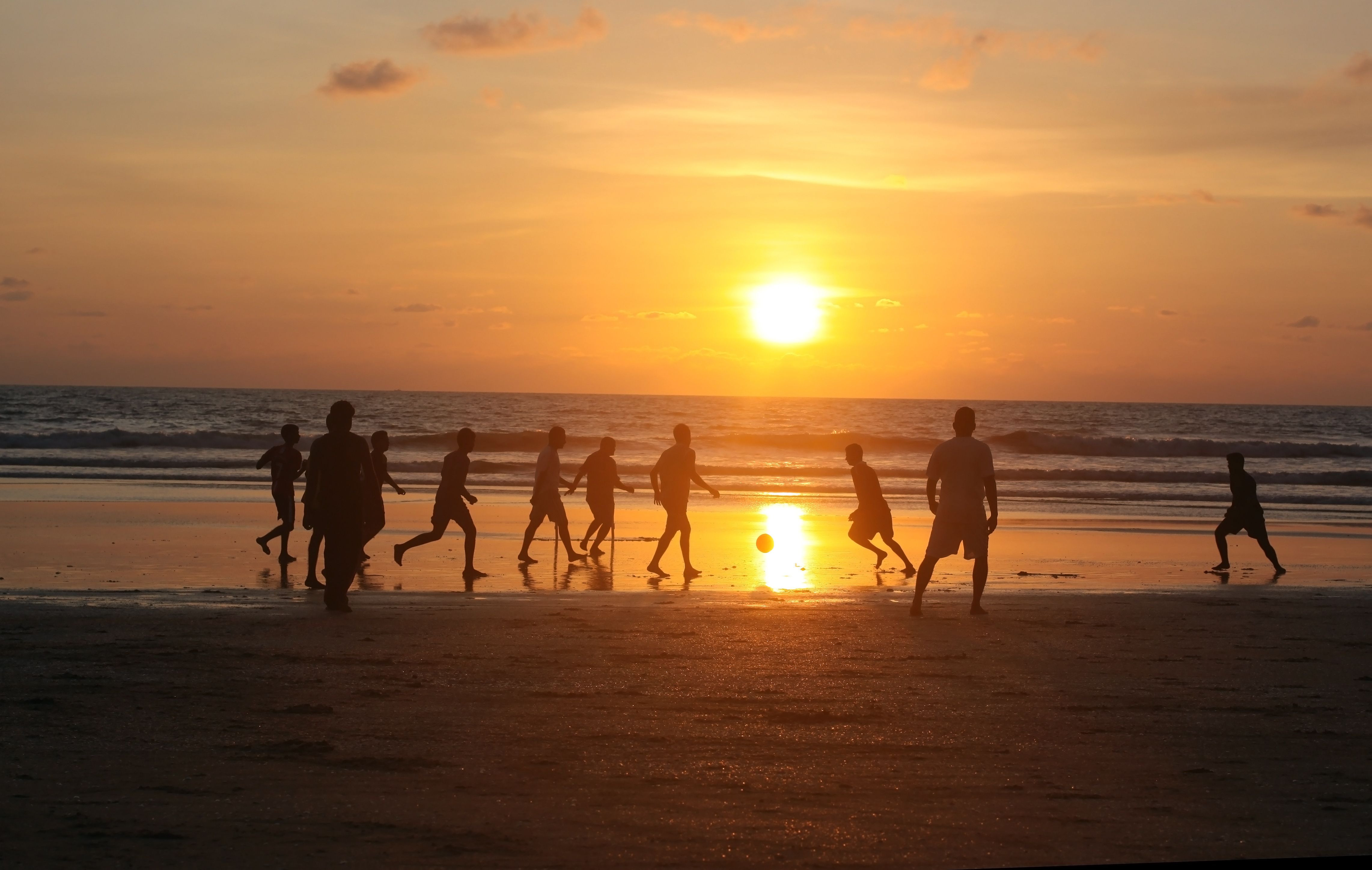 4566x2894 Boys playing football on the beach in Goa Desktop wallpaper 1152x864