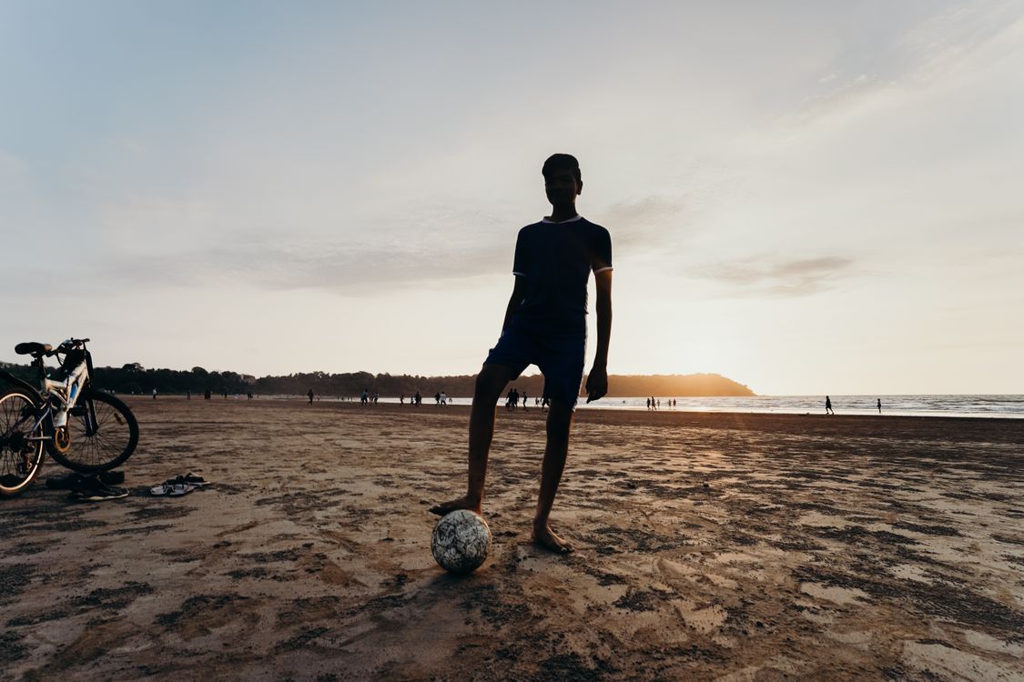 1125x750 Silhouette of Man Playing Soccer on Beach during Sunset · Free