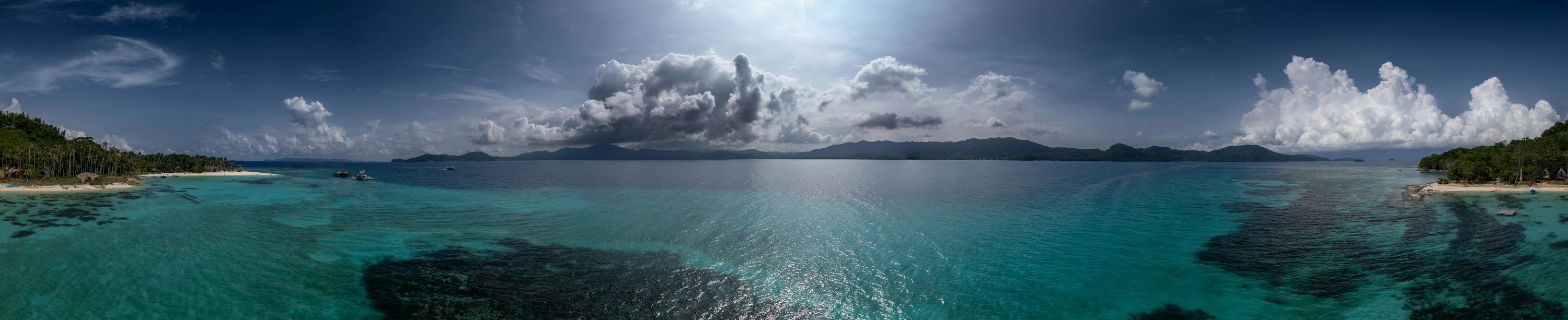 3000x613 Tropical island coastline with clear turquoise water