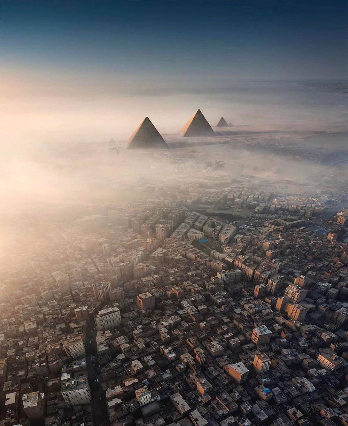 1125x1378 Download Greater Cairo's Pyramid Skyline Wallpaper