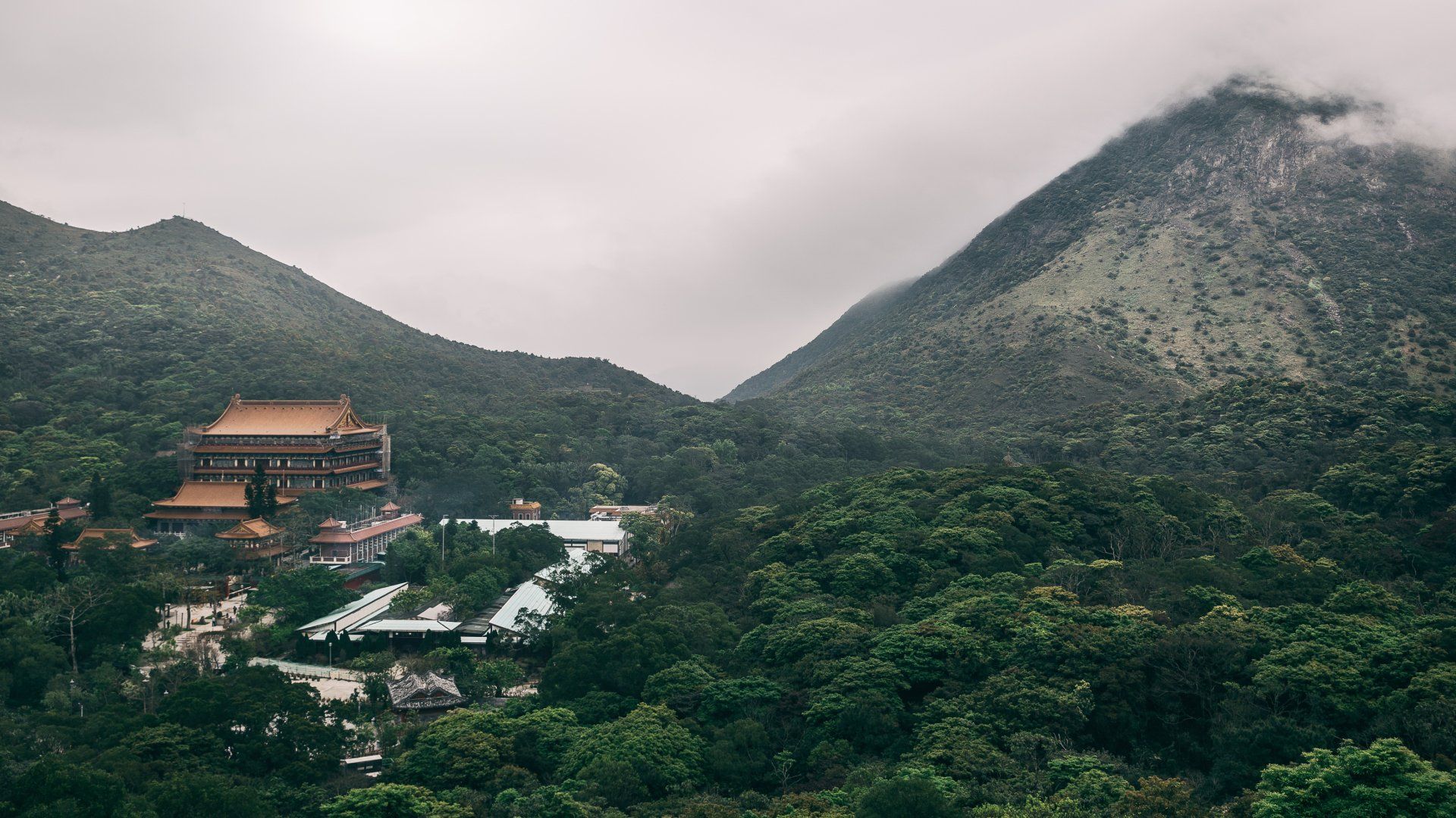 1920x1080 Misty Serenity: Po Lin Monastery Amid Lantau Island Mountains, Hong Kong, Chinax1997