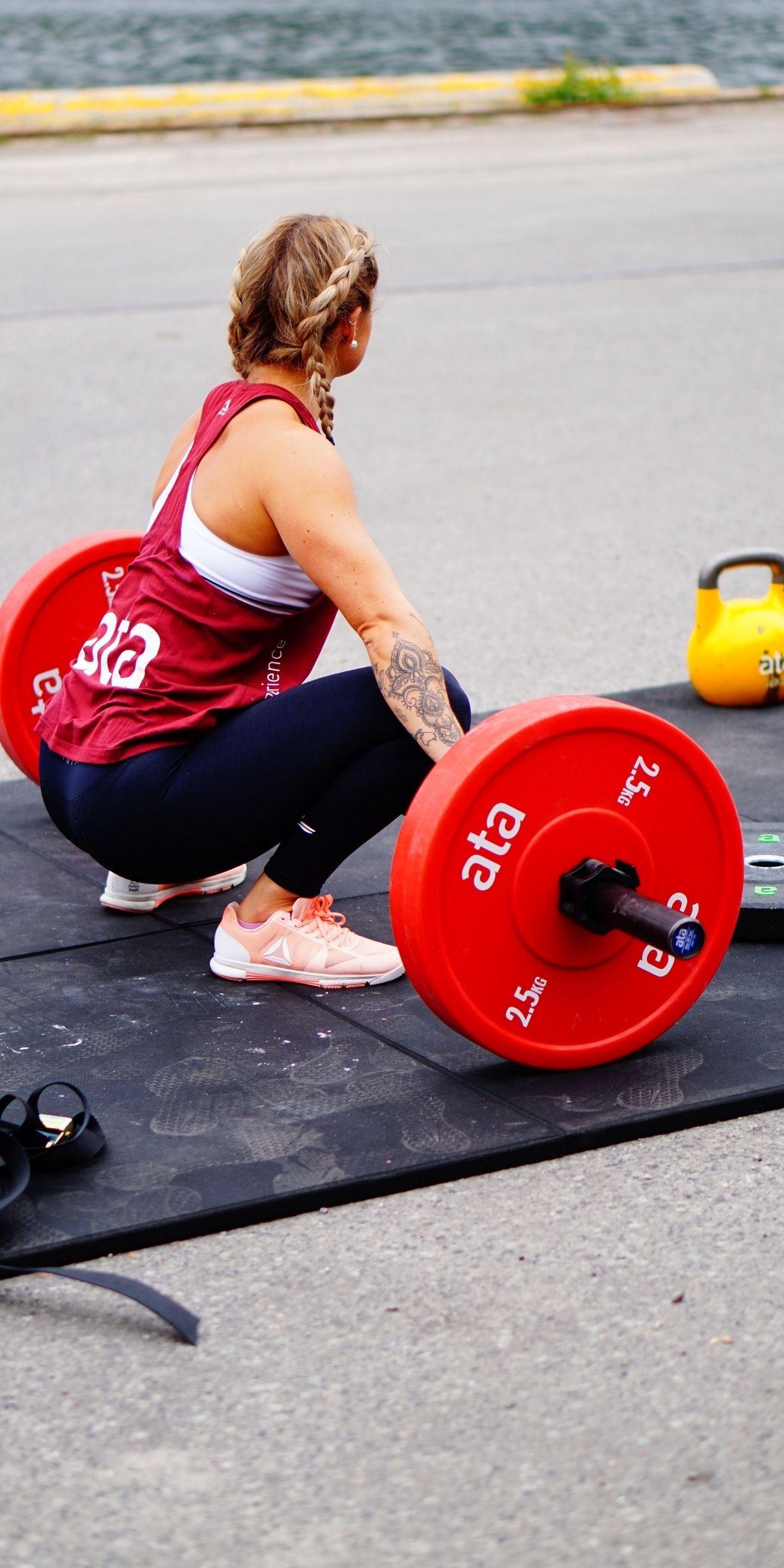 1440x2880 Girl Doing Weight Lifting