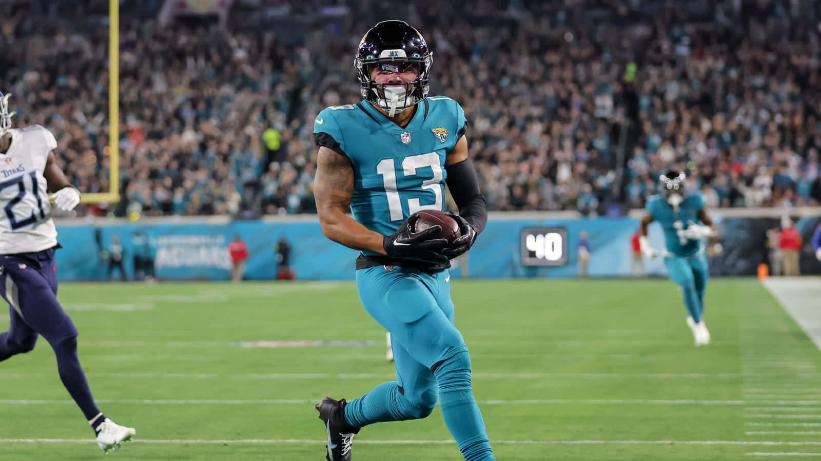 1600x900 Download Christian Kirk Football Blue Green Jersey Wallpaper