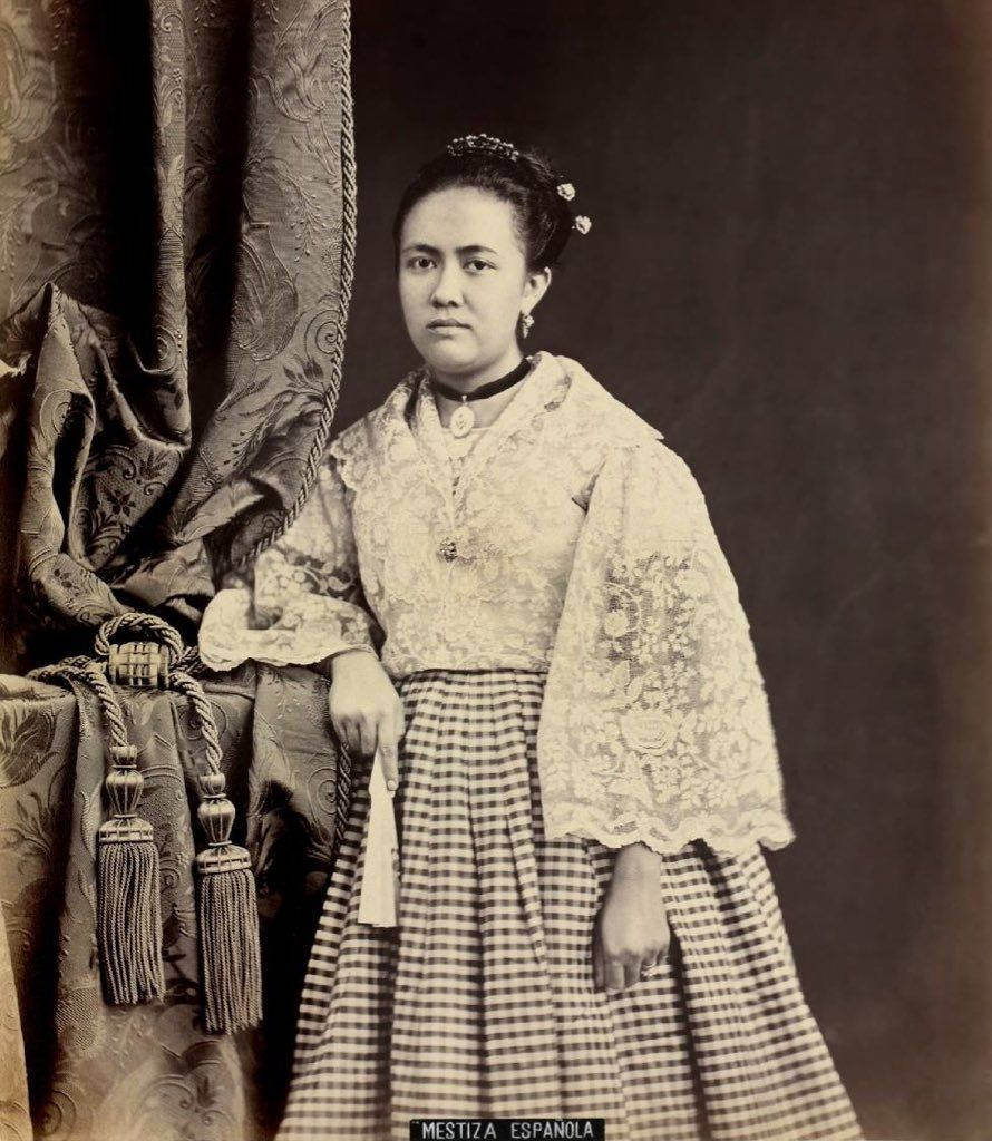 890x1024 Download Caption: Maria Clara showcasing the elegant traditional Filipina ensemble De Mestiza. Wallpaper