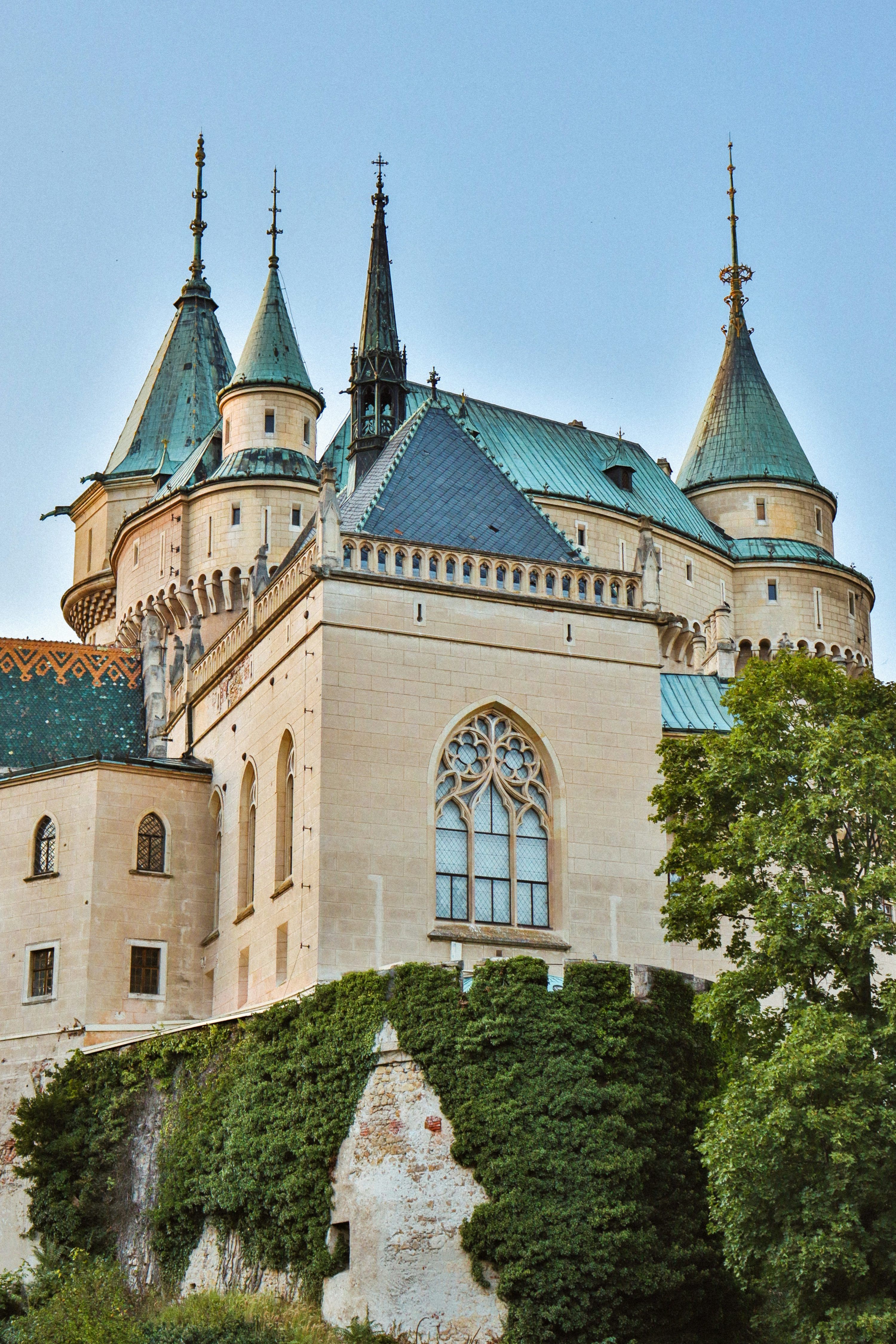 3000x4500 A large castle with a clock tower on top of it