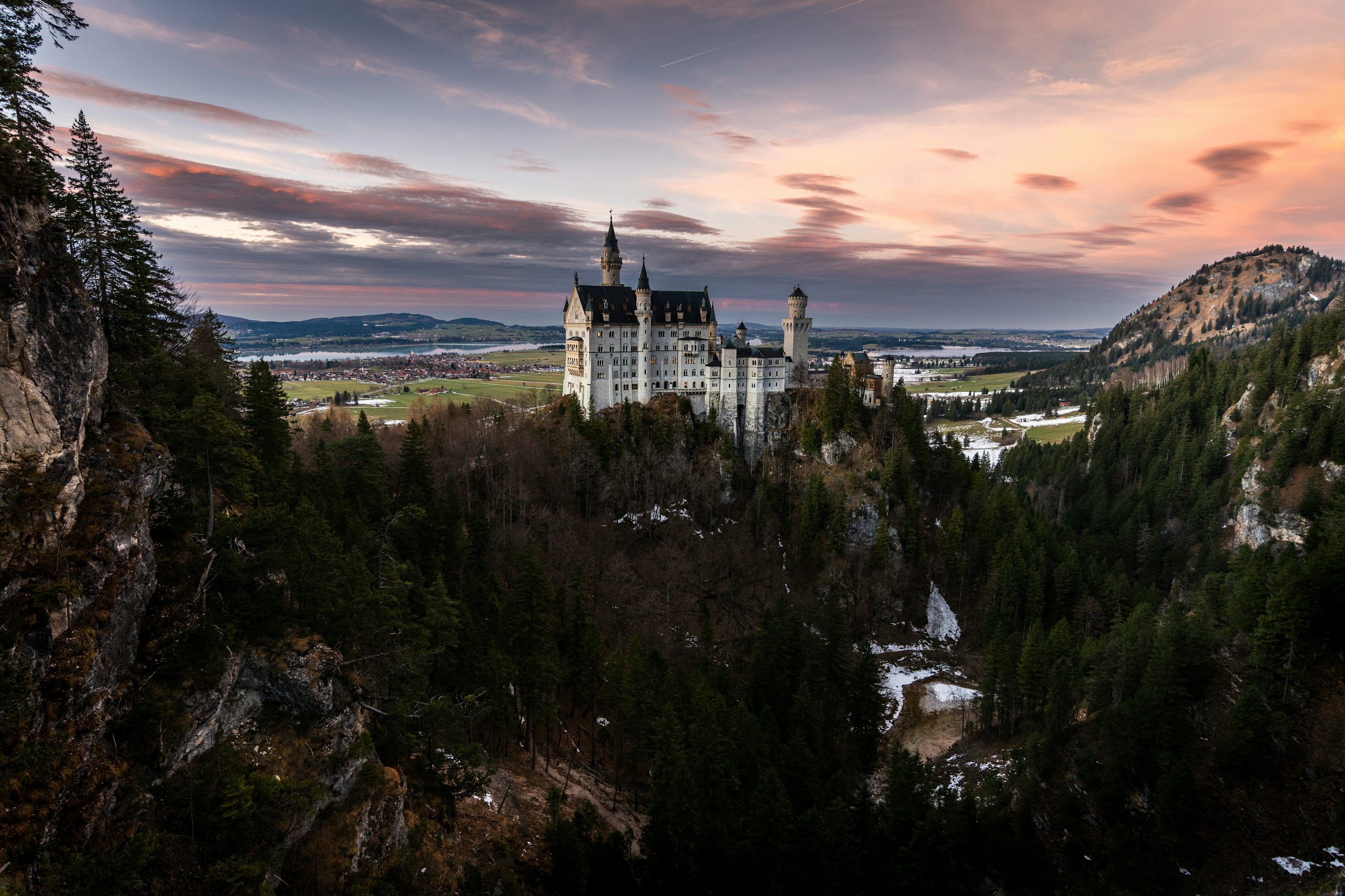 3000x2000 A castle on top of a mountain surrounded