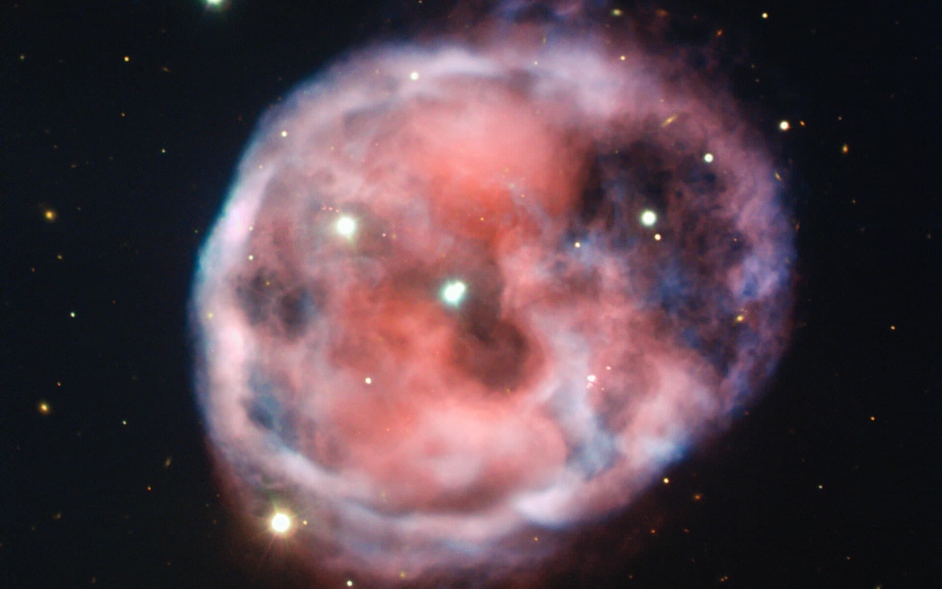 1920x1200 Telescope captured bloodshot colors of eerie Skull Nebula