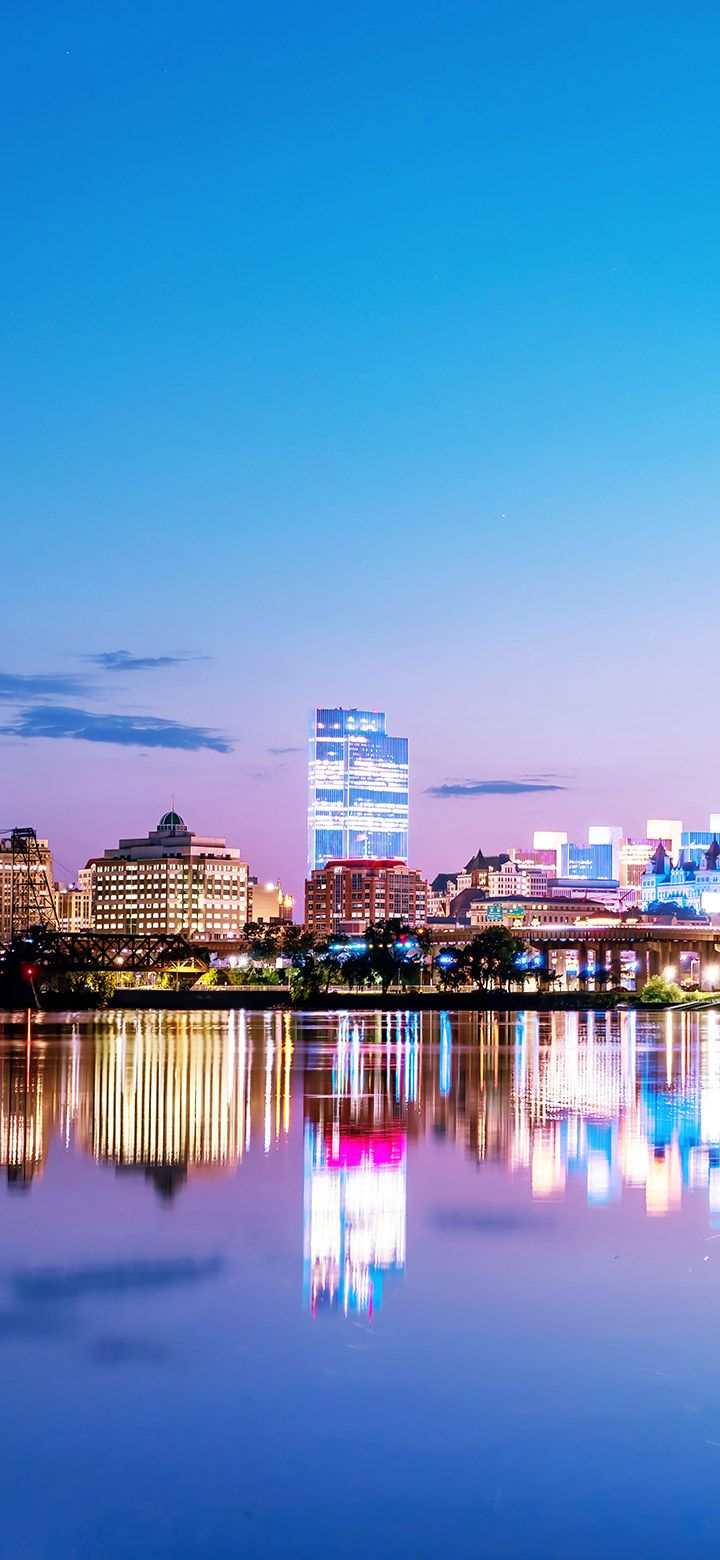 720x1560 Evening Reflection Of The City On Blue Lake 4K phone Wallpaper