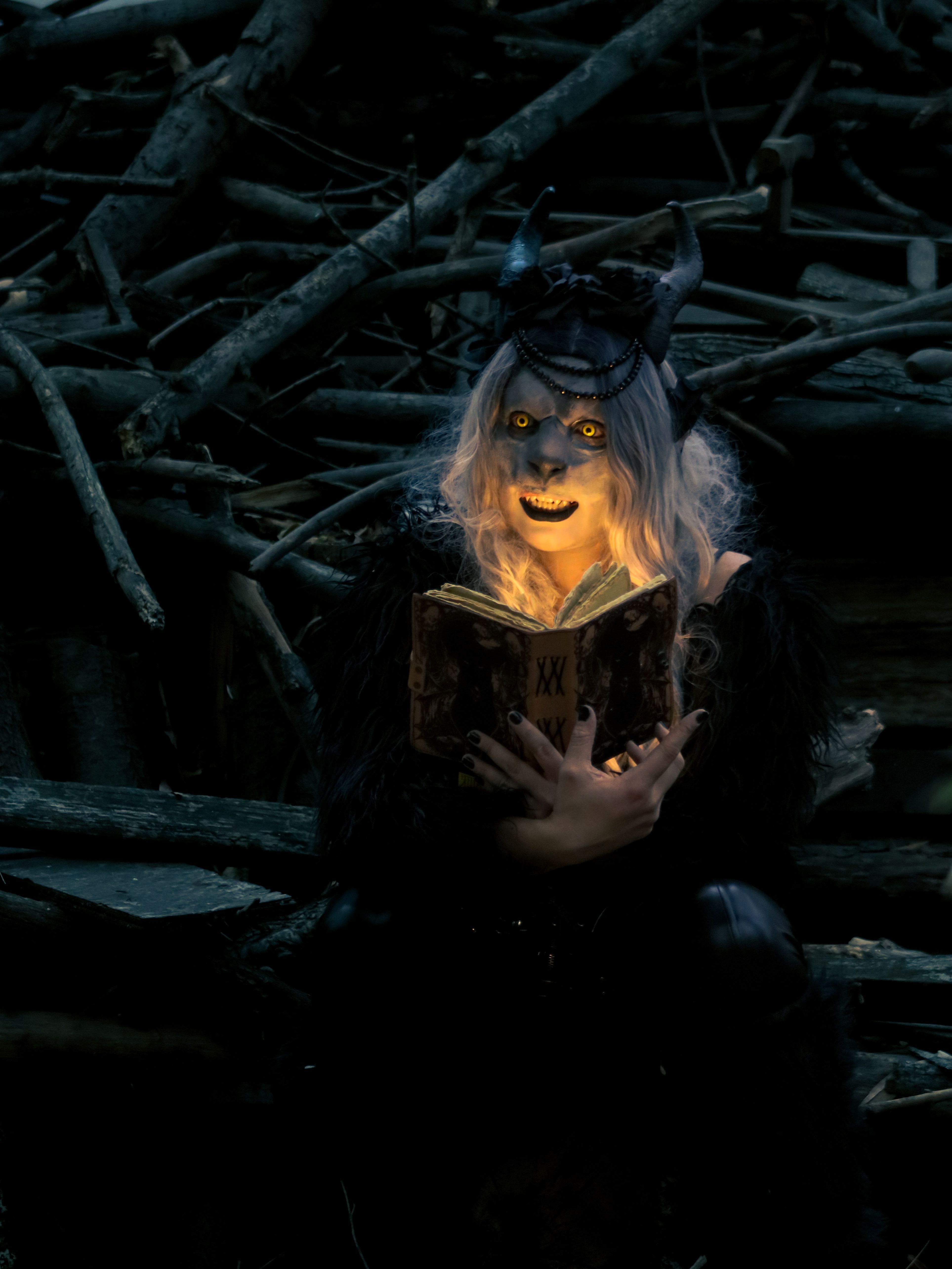 3854x5133 Mysterious Figure Reading in Dark Forest · Free