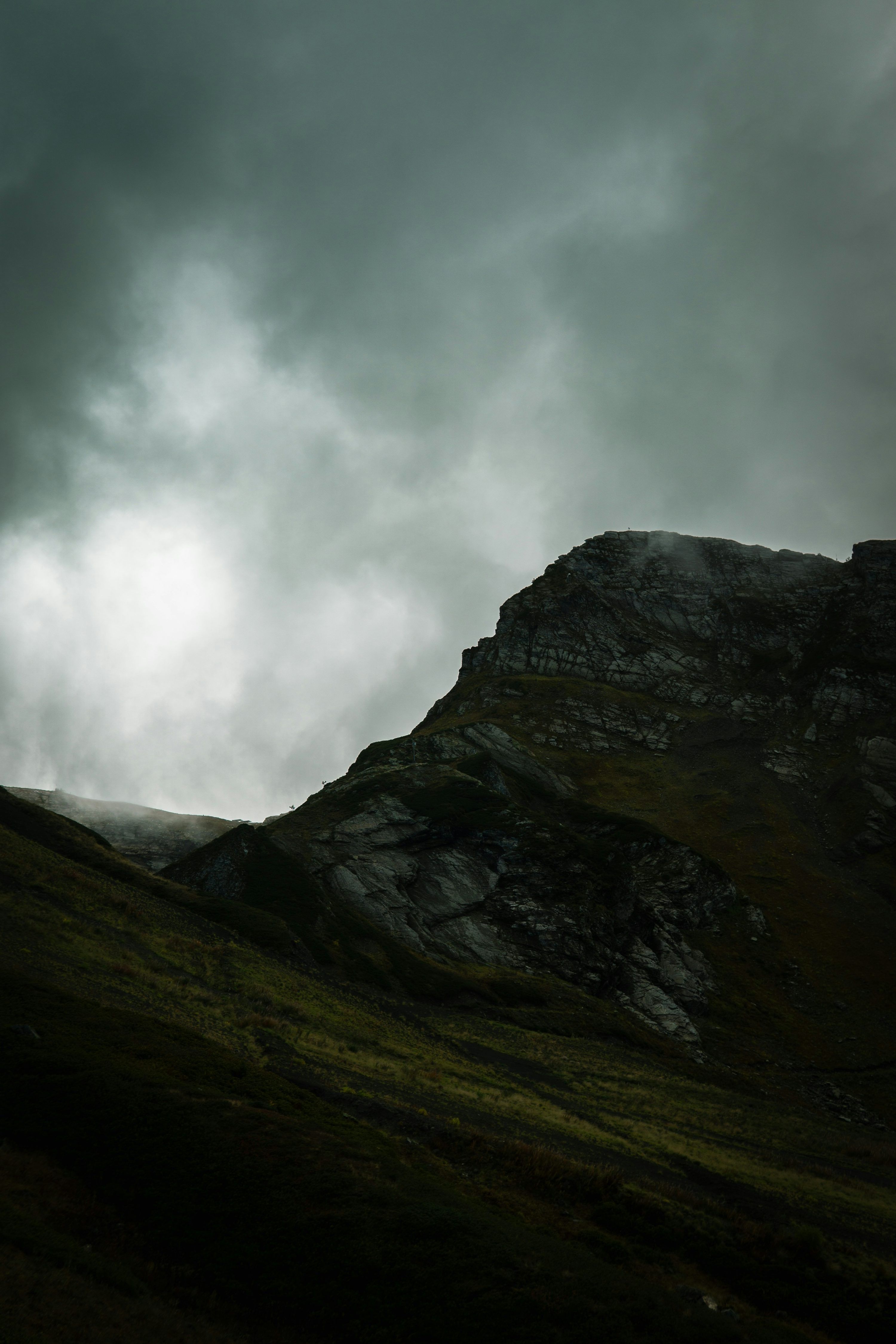 3000x4500 Dramatic mountain peak under stormy, cloudy skies
