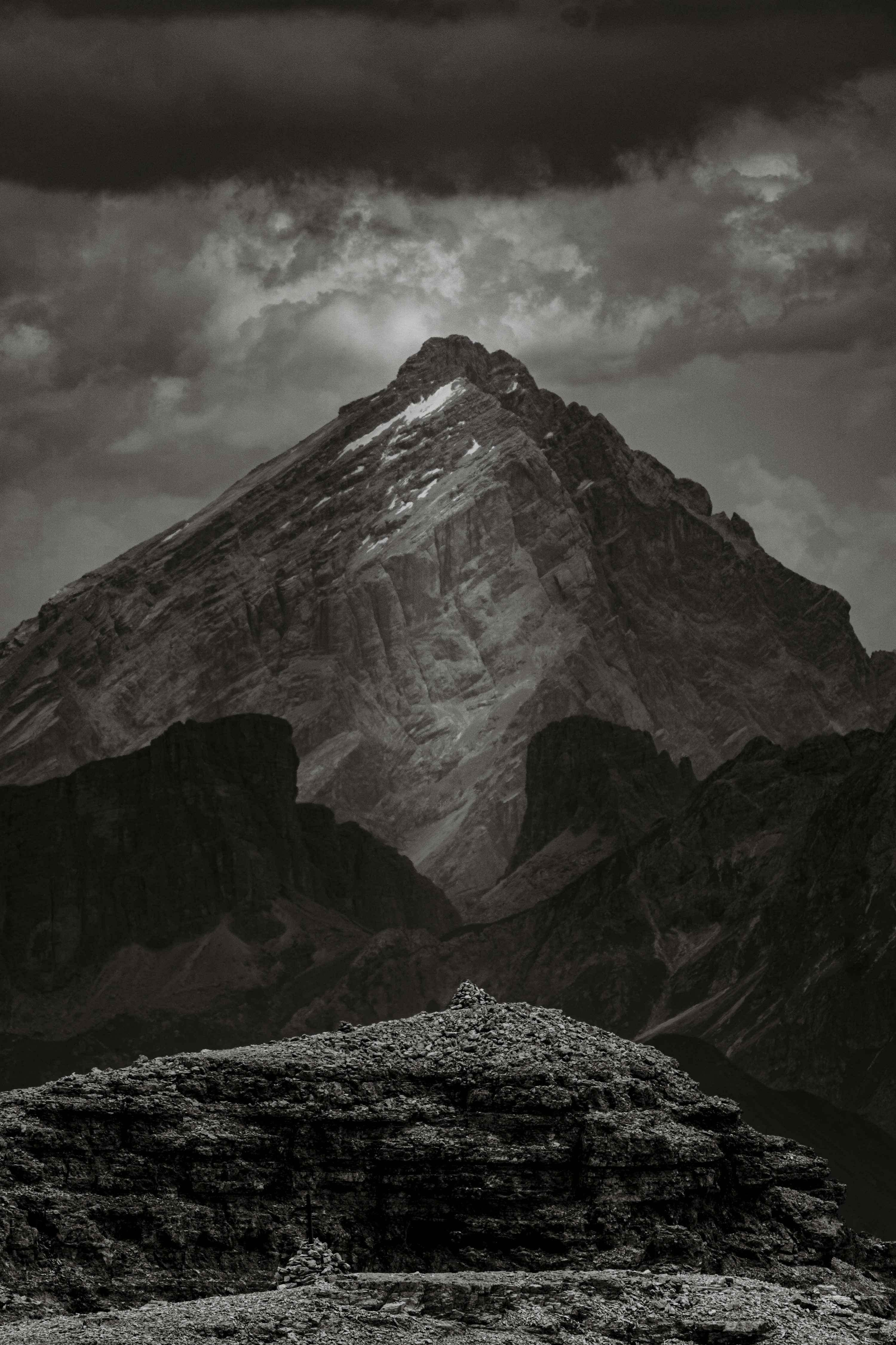 3000x4500 A majestic mountain towers beneath a stormy sky
