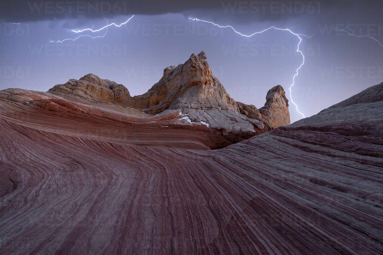 1232x821 Pictureque scenery of rough rocky mountains under stormy dark sky with lightnings in evening in Utah in USA