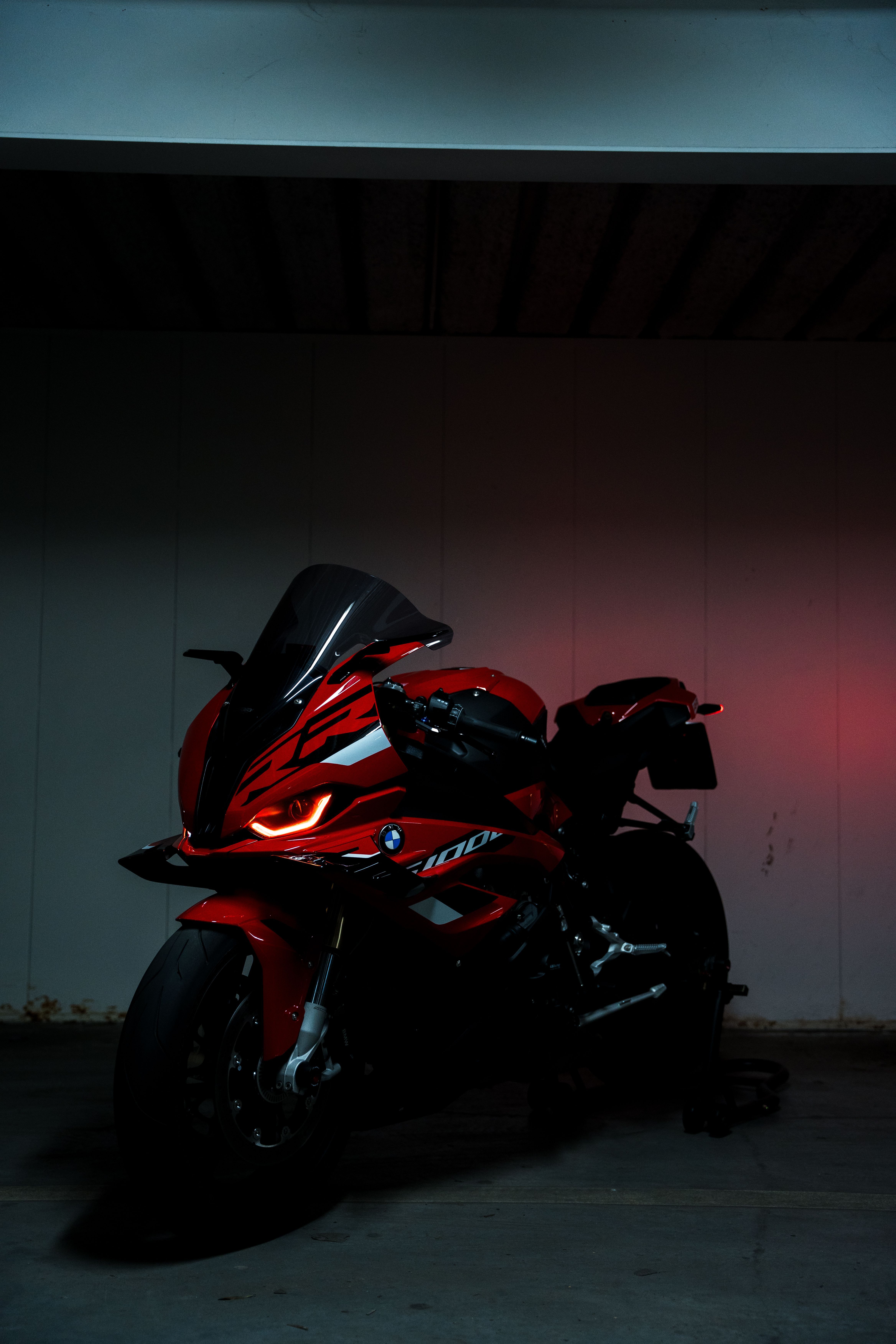 4672x7008 Sleek Red Motorcycle in Dark Garage · Free