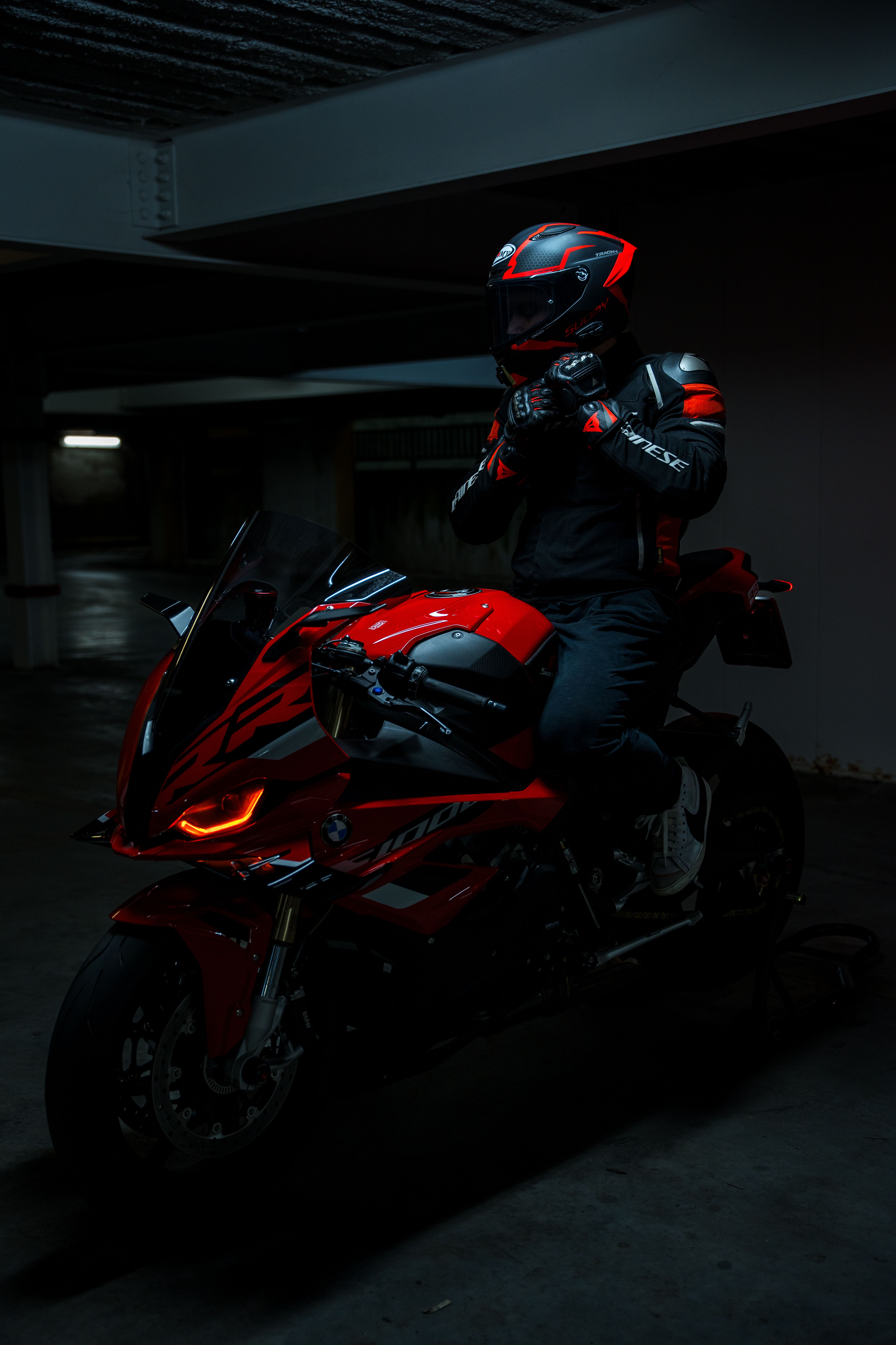 4672x7008 Red Sport Motorcycle Rider in Urban Garage · Free
