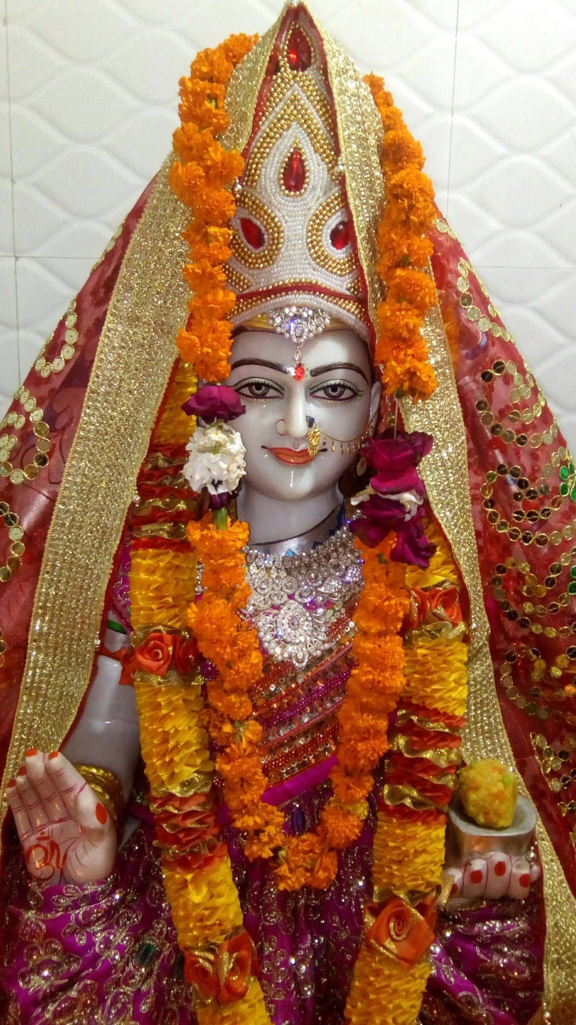 1152x2048 Download Divine Blessings Maa with Floral Offerings Wallpaper