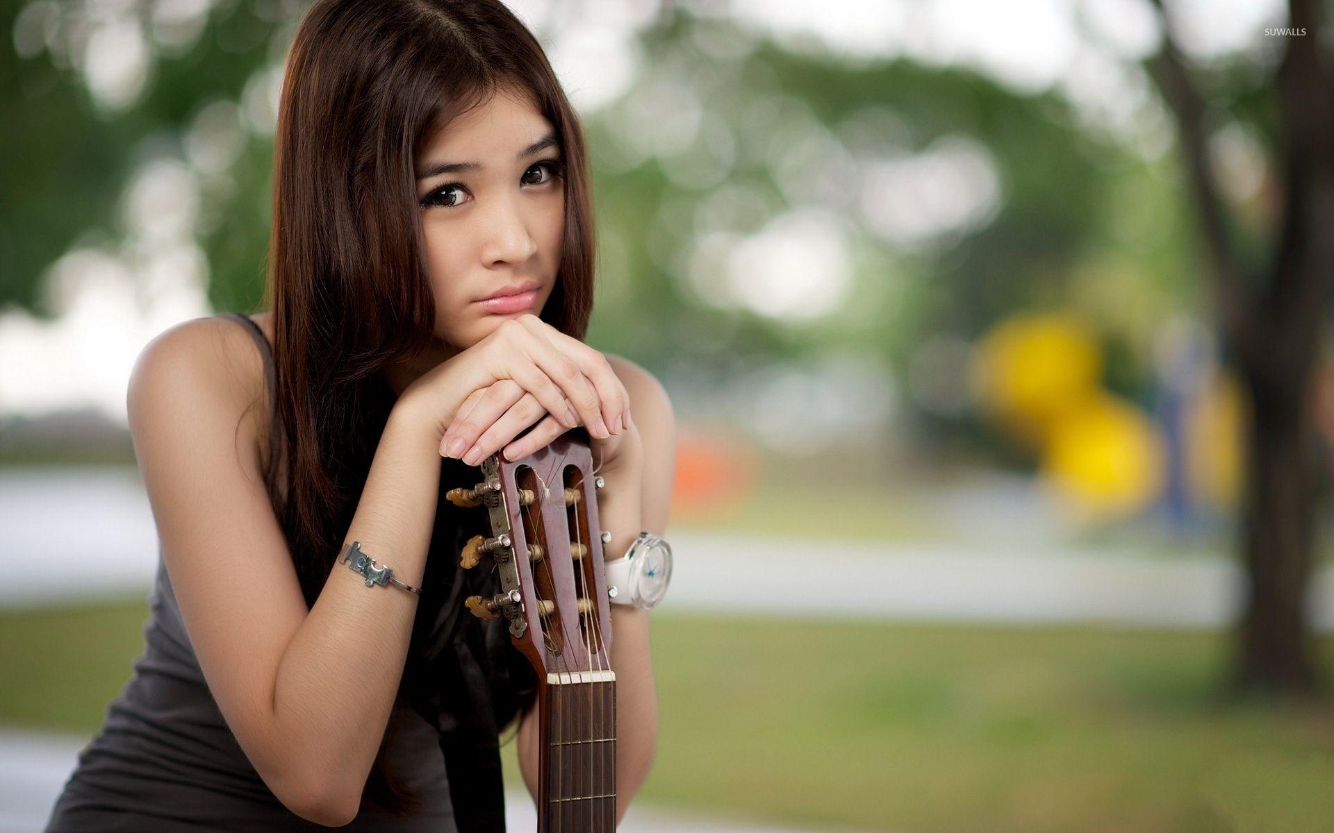 1920x1200 Sad asian girl with a guitar wallpaper wallpaper