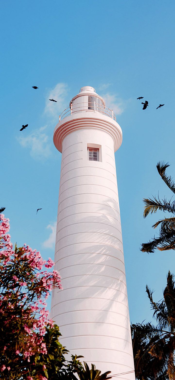 720x1560 Aesthetic marine lighthouse during the early morning 4K phone Wallpaper