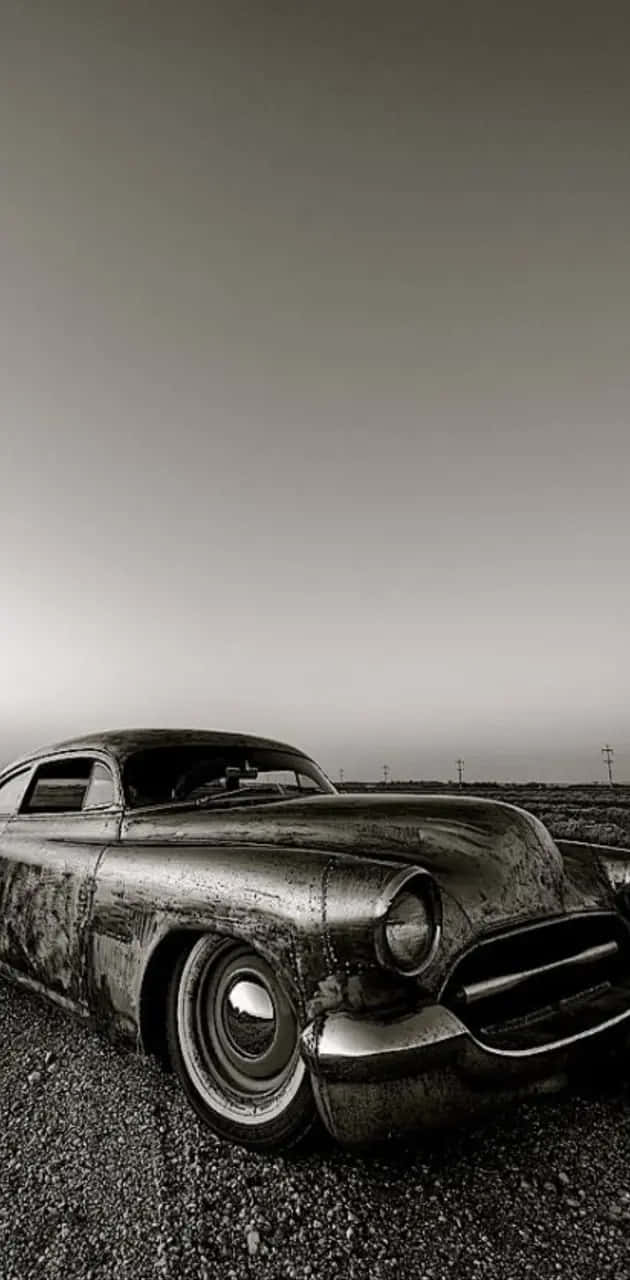 630x1280 Download Vintage Car Deserted Landscape Wallpaper