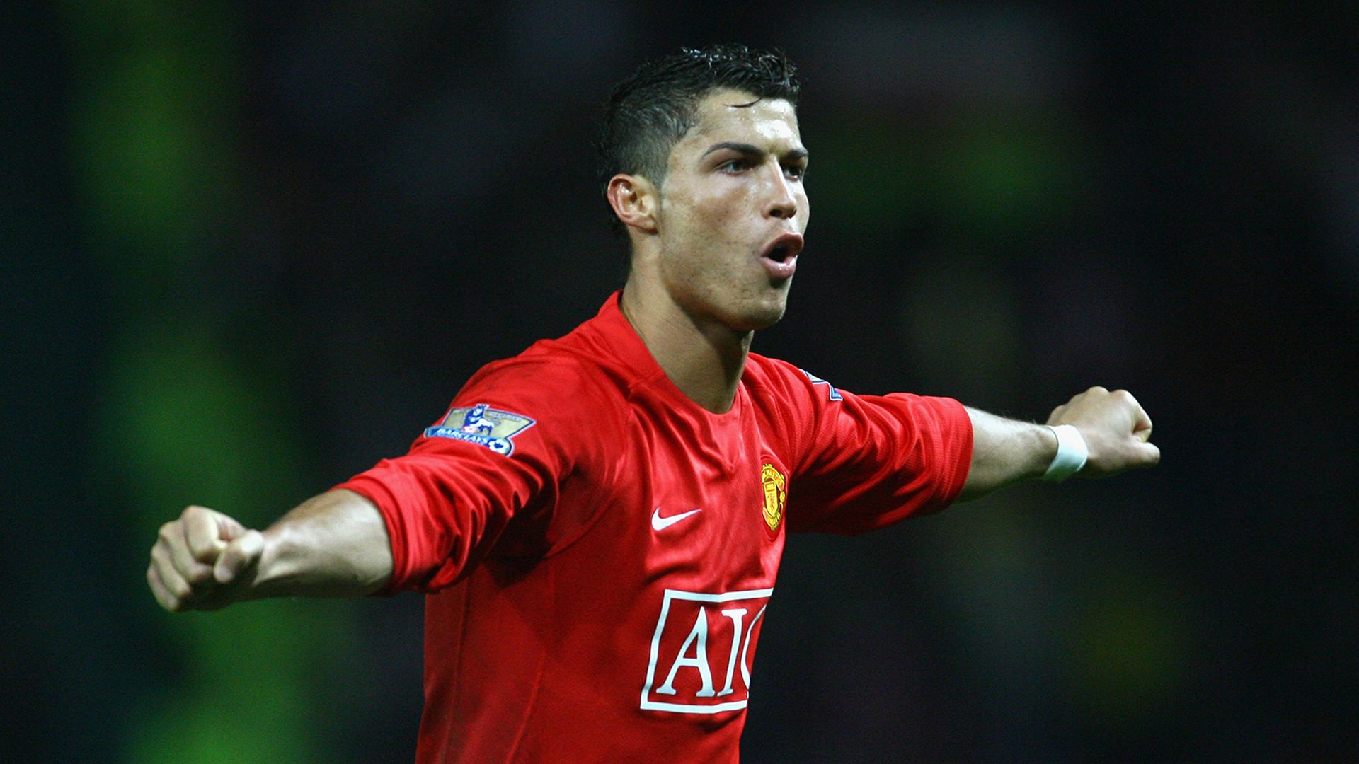 1920x1080 Cristiano Ronaldo Is Wearing Red Sports Dress In Blur Background HD Manchester United F.C Wallpaper