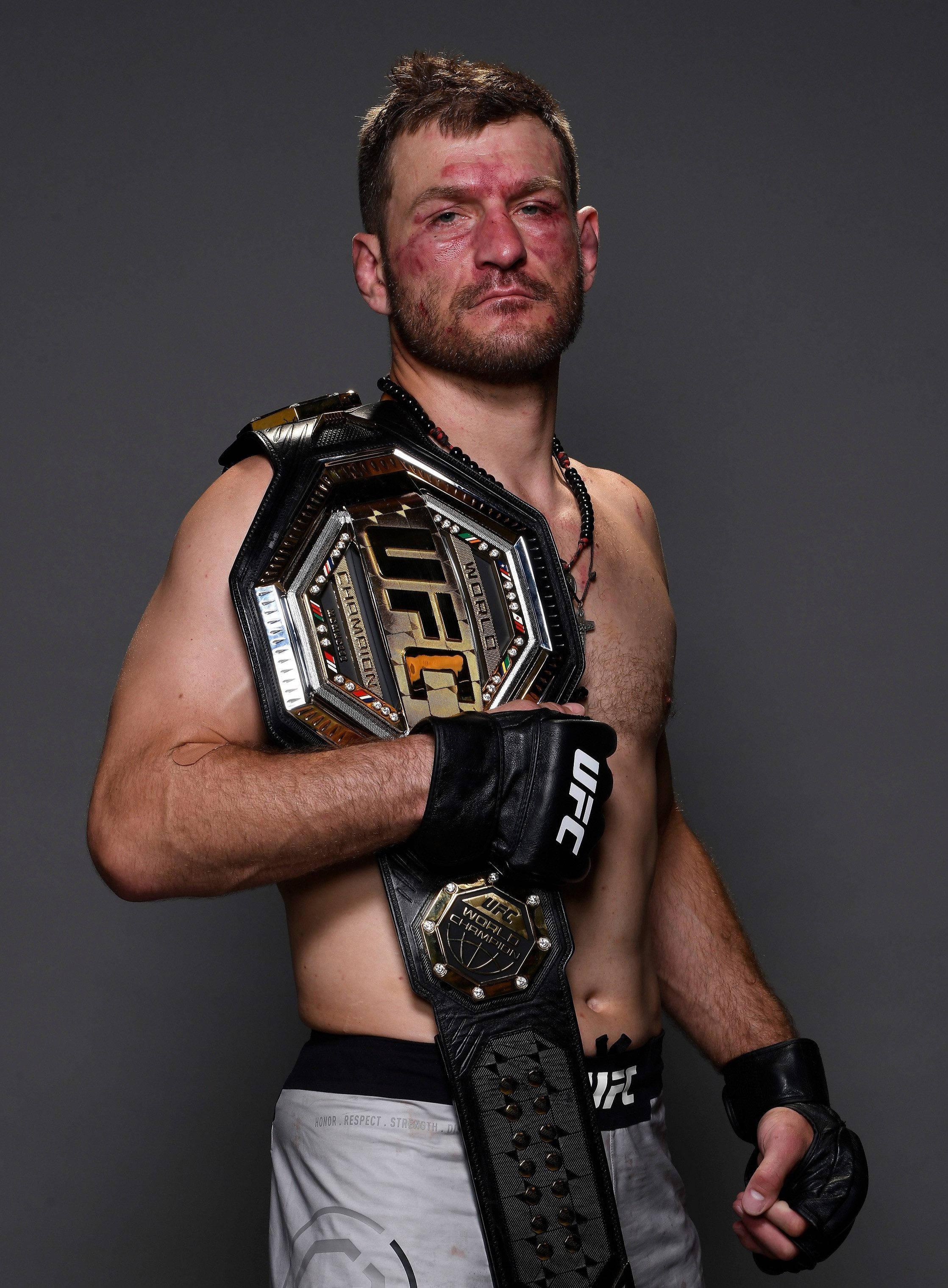 2237x3038 Download Stipe Miocic yet victorious, showcasing his championship belt Wallpaper