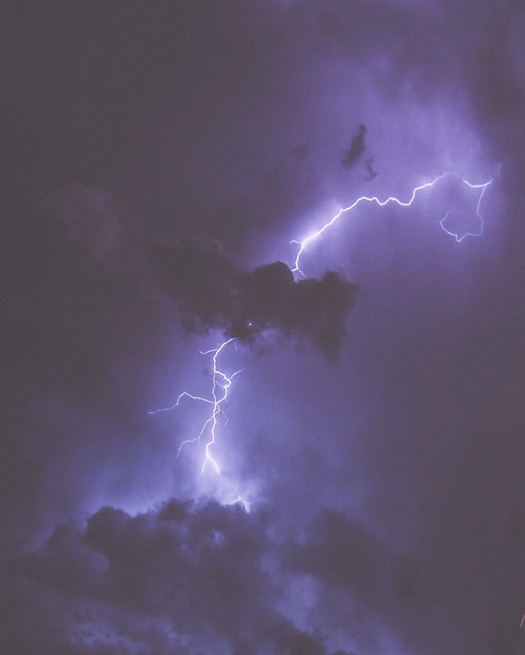 1026x1280 Download The Eye Catching Sight Of A Storm Filled Skyline During A Blitz Of Aesthetic Lightning. Wallpaper