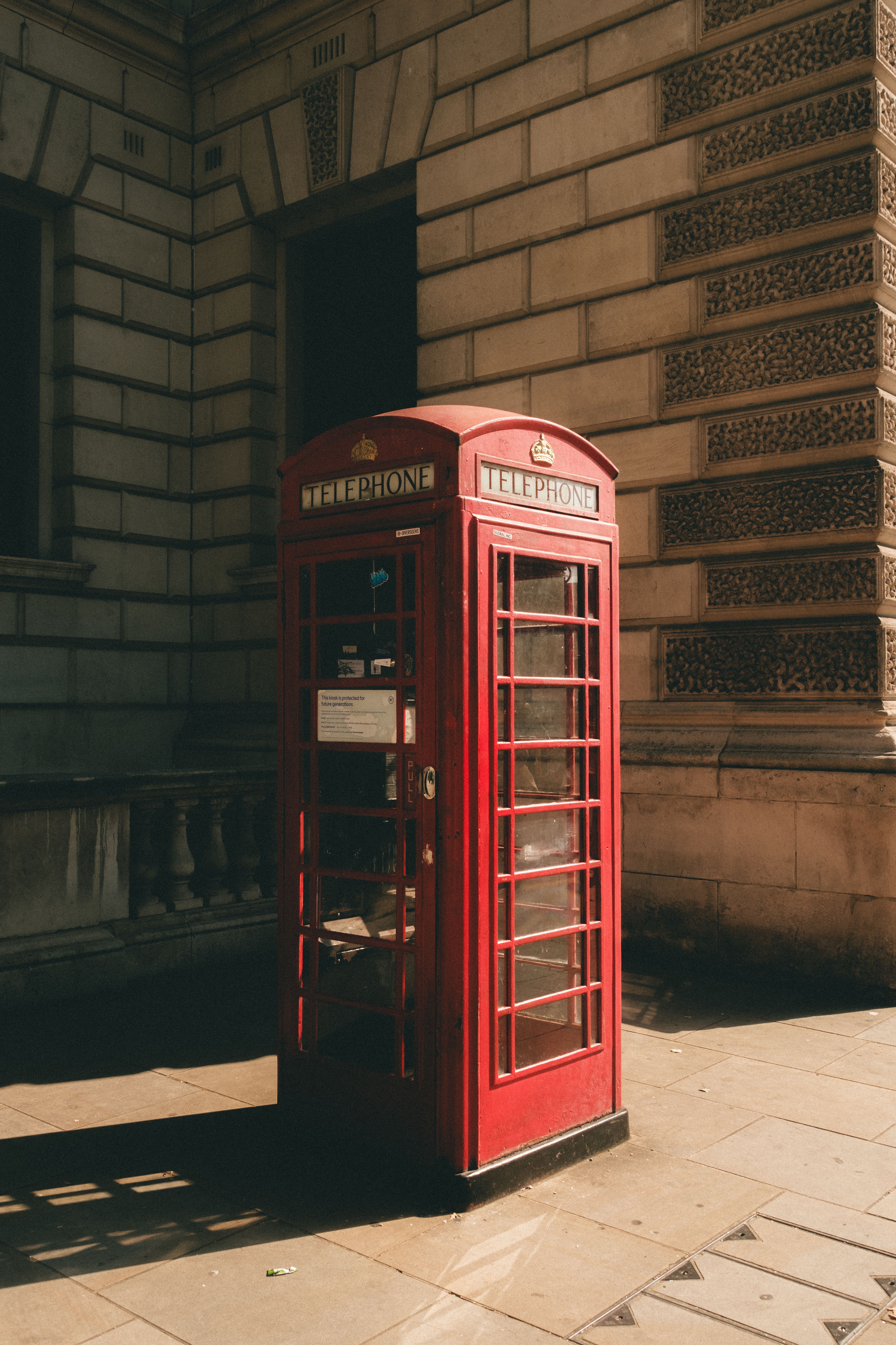 5152x7728 Iconic Red Telephone Box in Urban Setting · Free