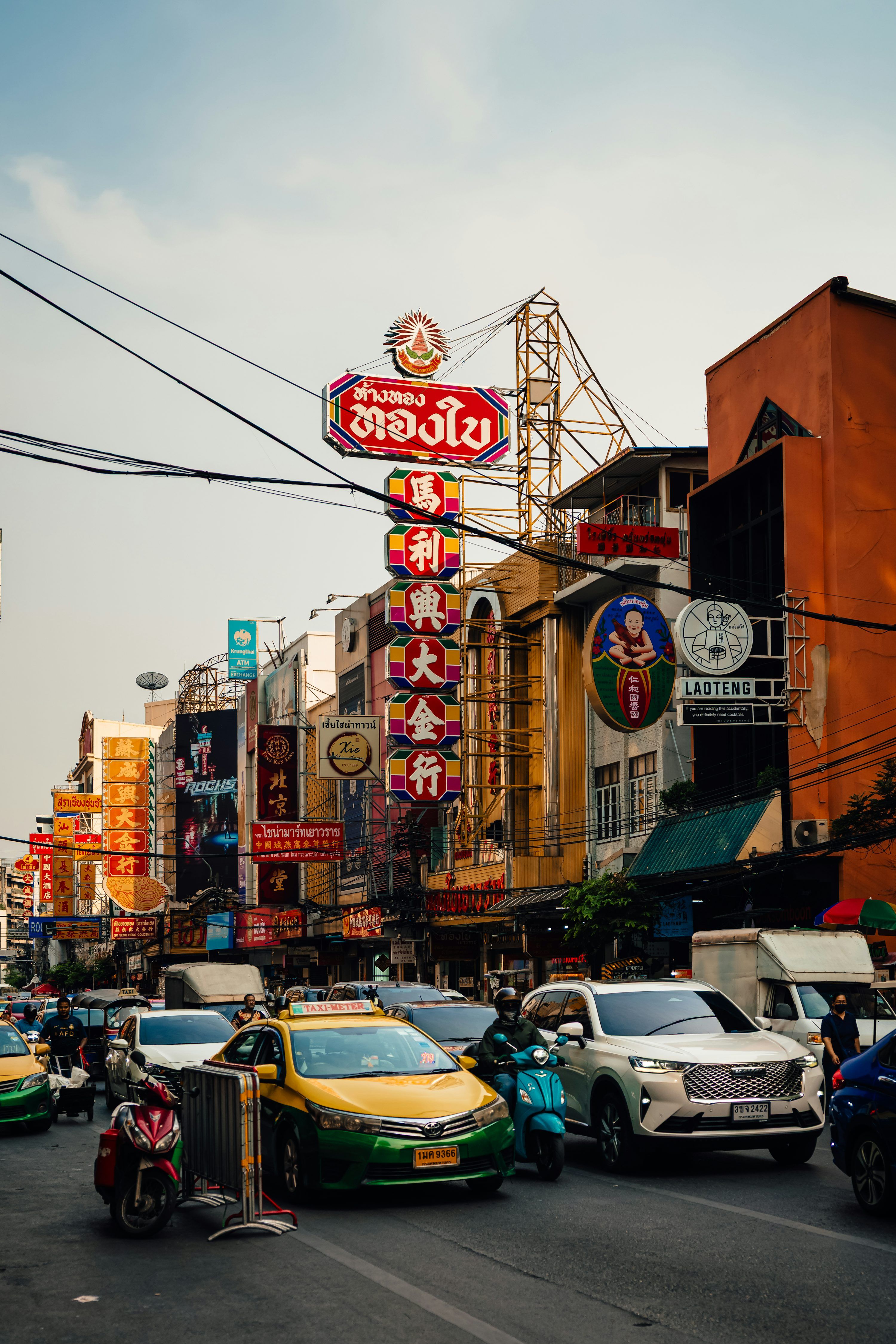 3000x4500 Busy chinatown street with bright signs and traffic