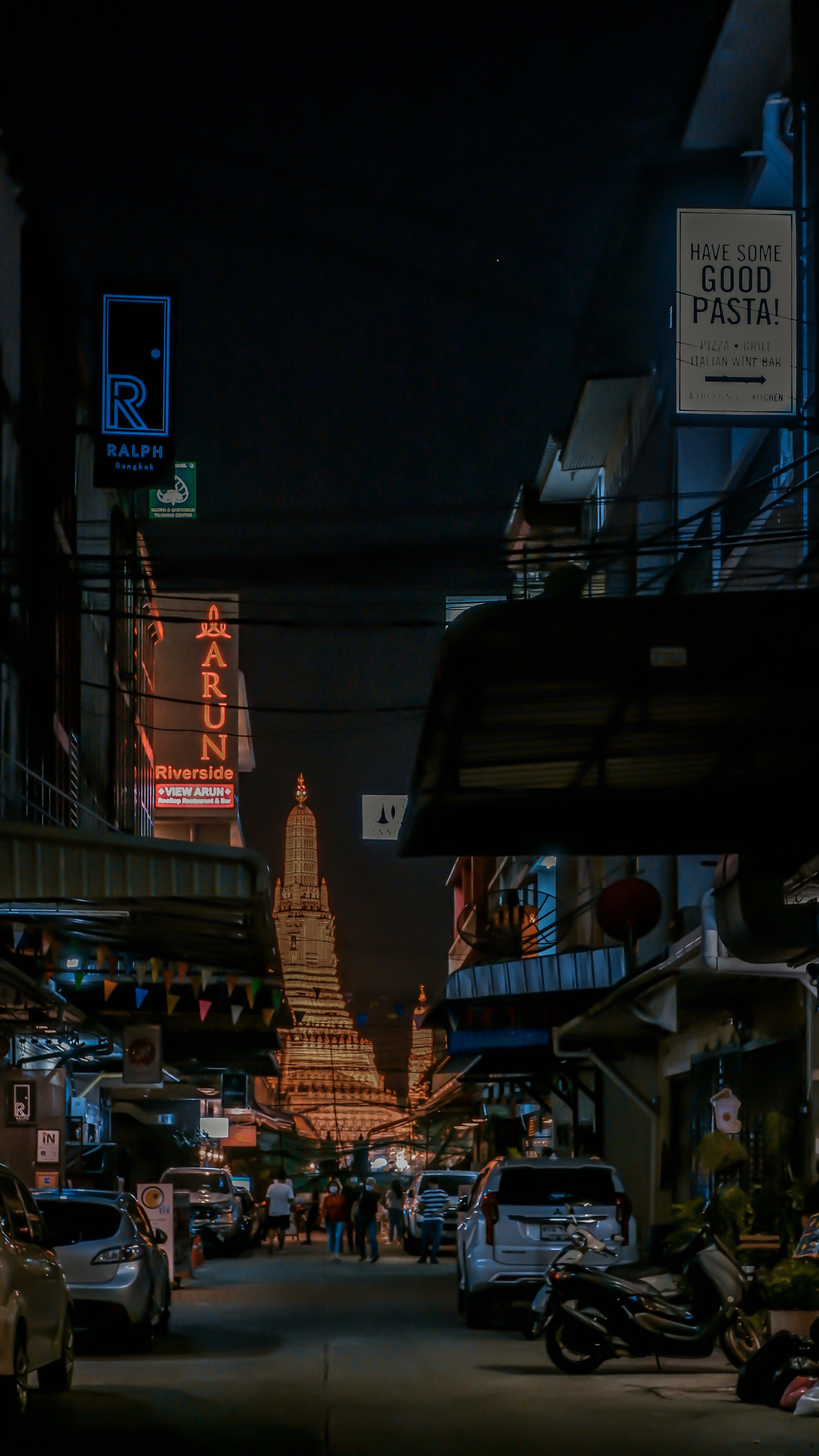 3000x5332 A city street filled with lots of traffic at night
