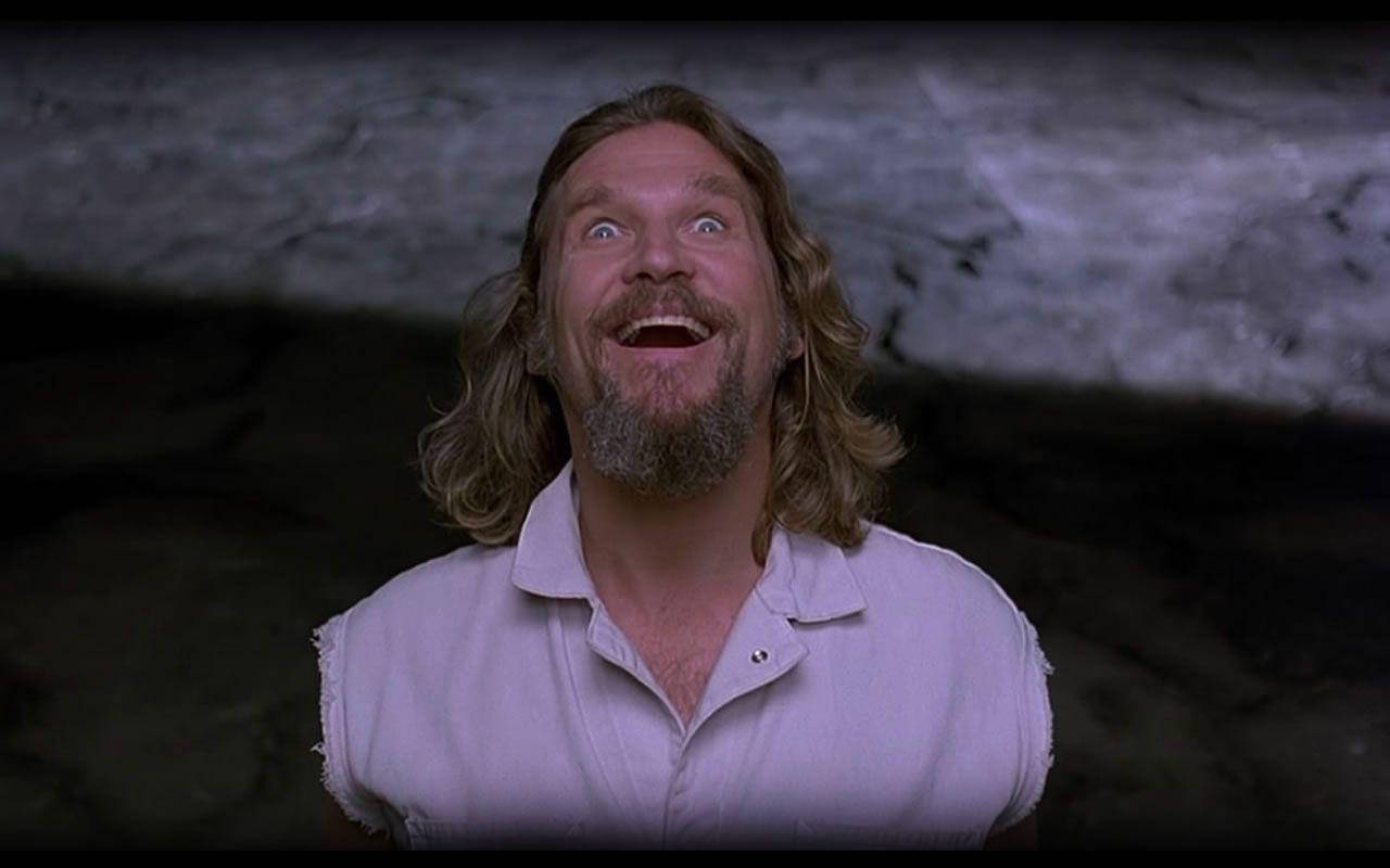 1280x800 Download The Dude, The Quirky Character From The Cult Classic Film, The Big Lebowski, Looking Happy In An Iconic Movie Scene. Wallpaper
