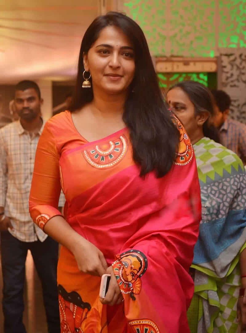 800x1084 Download Anushka Shetty Orange Saree Event Appearance Wallpaper