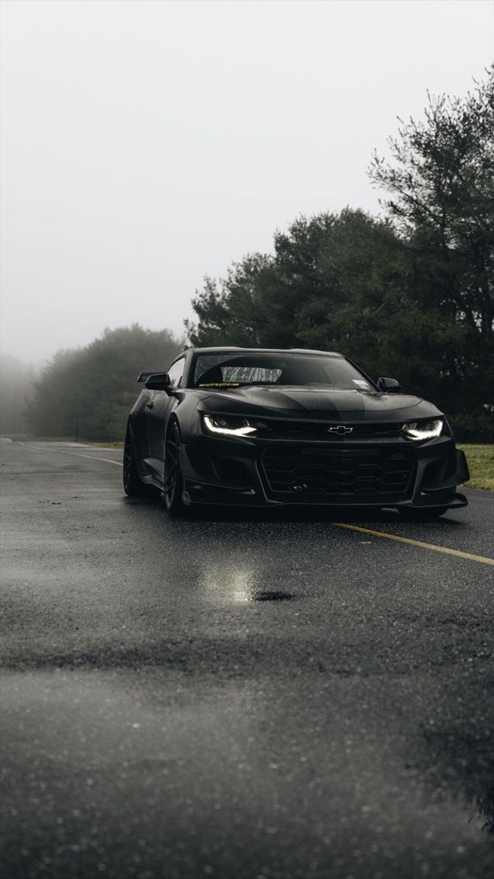 720x1280 Chevrolet Camaro 2022. Black Sports Car On Wet Road. Camaro Zl1 Black Wallpaper, Mid Engine Chevy S Car Wallpaper