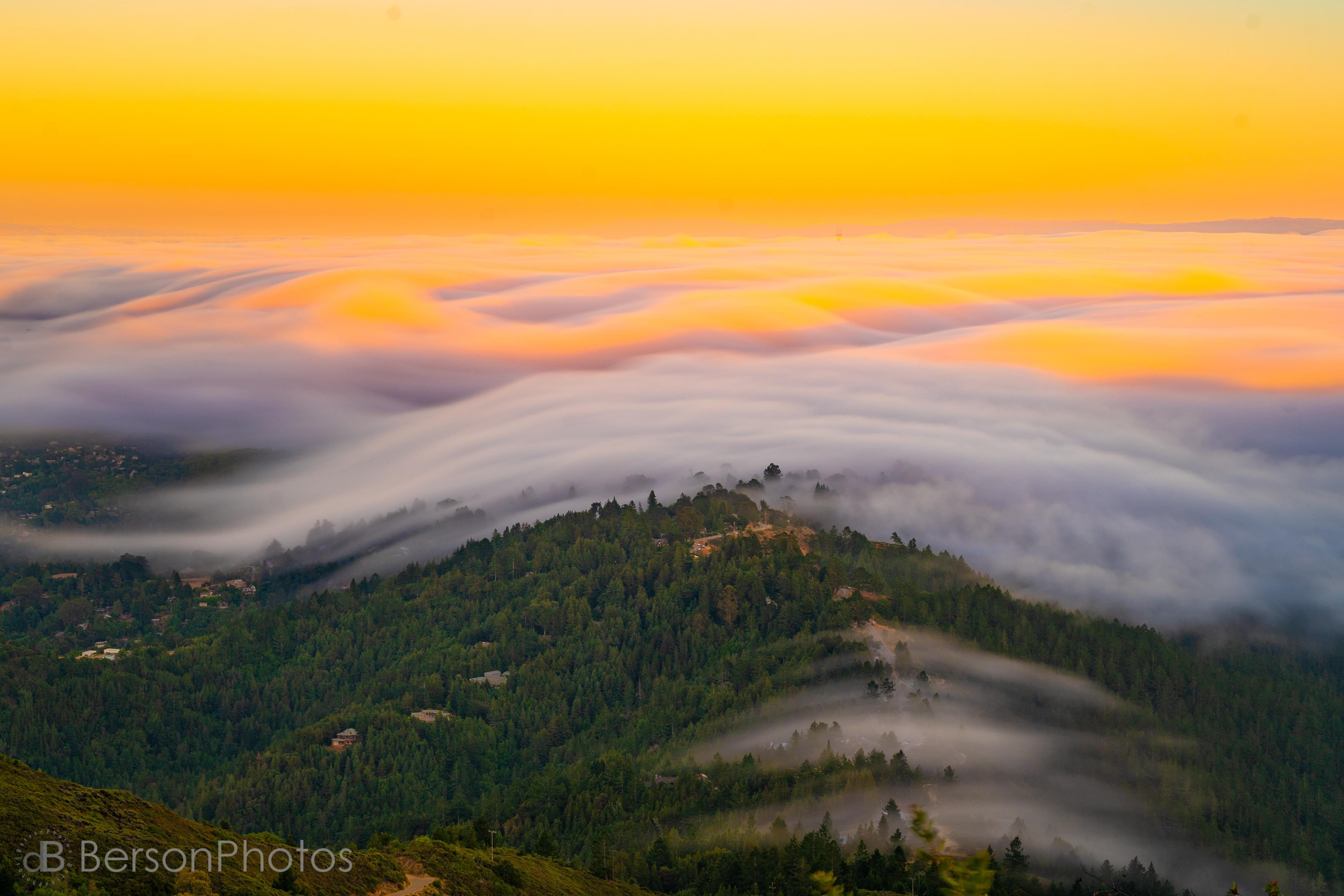 4602x3068 San Francisco's famous summer fog sweeps across the hills of Marin County, catching the last rays of the setting sun and flowing like wateres. Okay, I love it here!