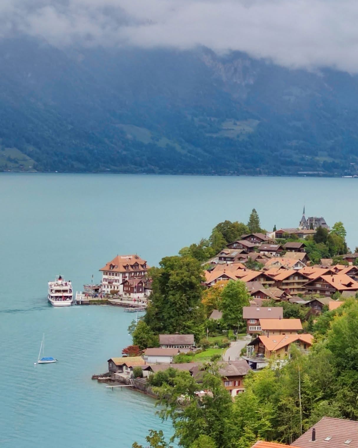1215x1519 Pin Iseltwald, Switzerland. Explore classic Swiss villages, admire castles by the river surrounded by mountains and mist ⛰️