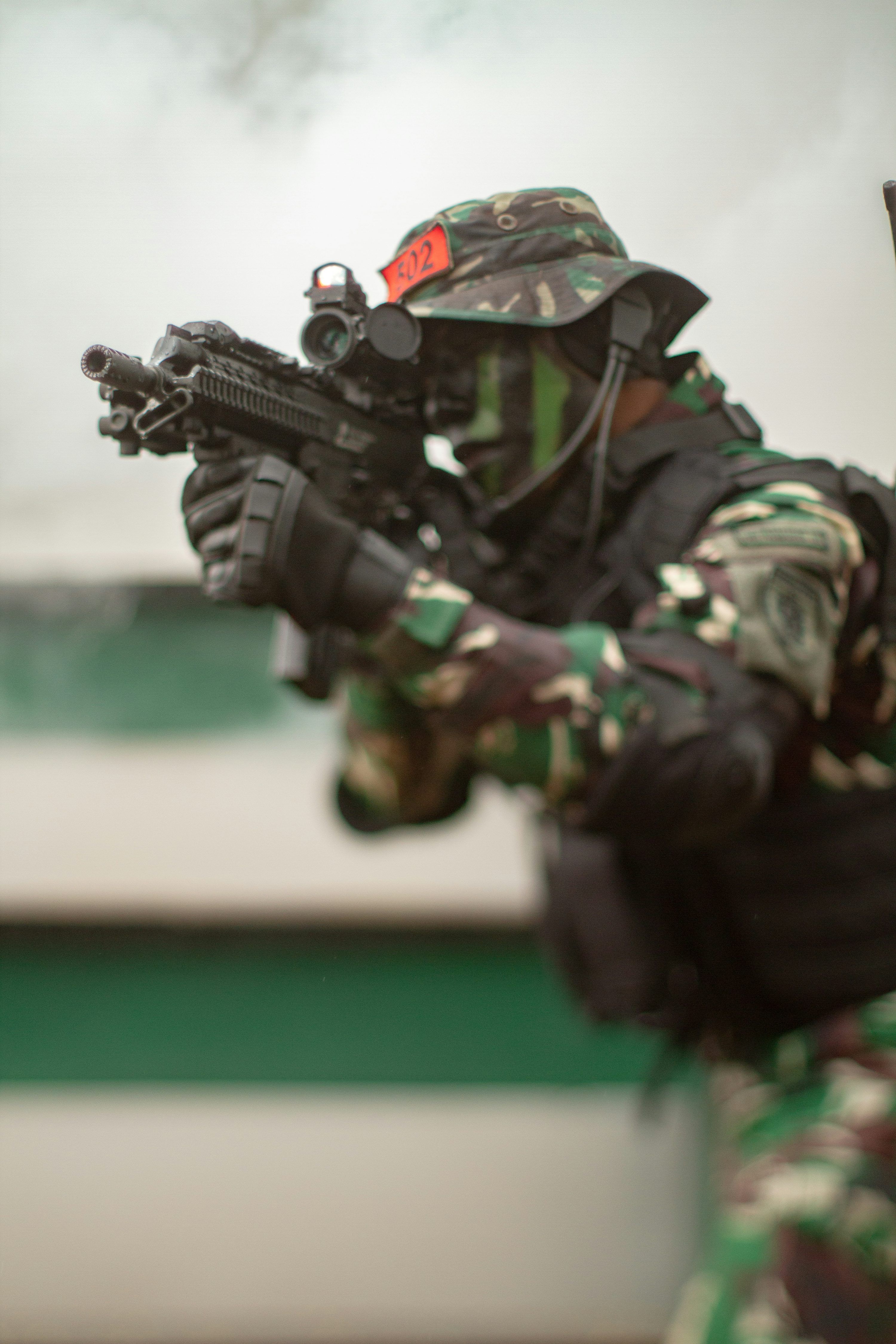 3000x4500 Soldier holding black rifle during daytime